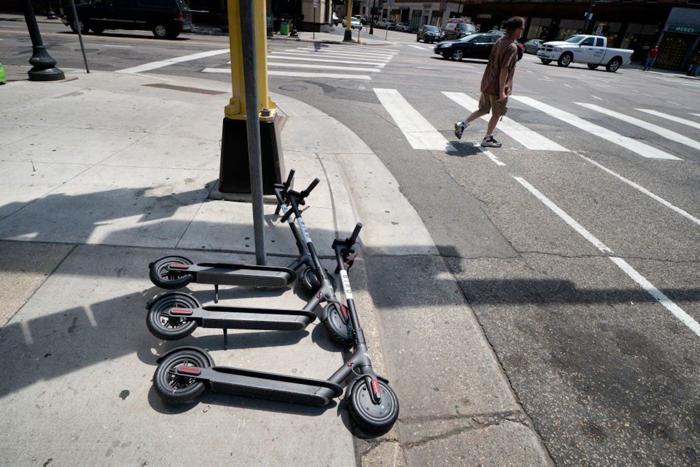 Three Bird scooters were on the sidewalk at 9th and Hennepin in downtown Minneapolis.