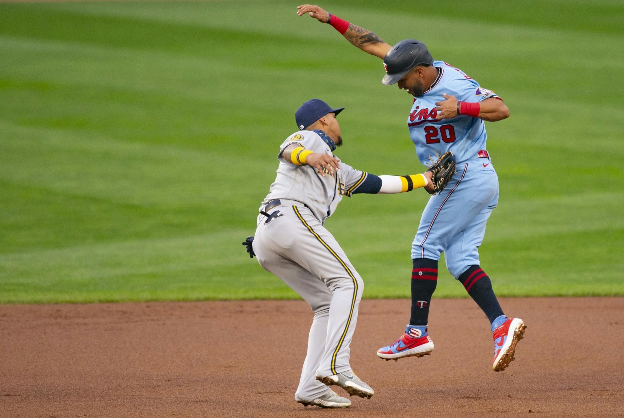 Milwaukee Brewers shortstop Orlando Arcia (3) tagged out Minnesota Twins left fielder Eddie Rosario (20) as he tried to steal second base in the second inning.