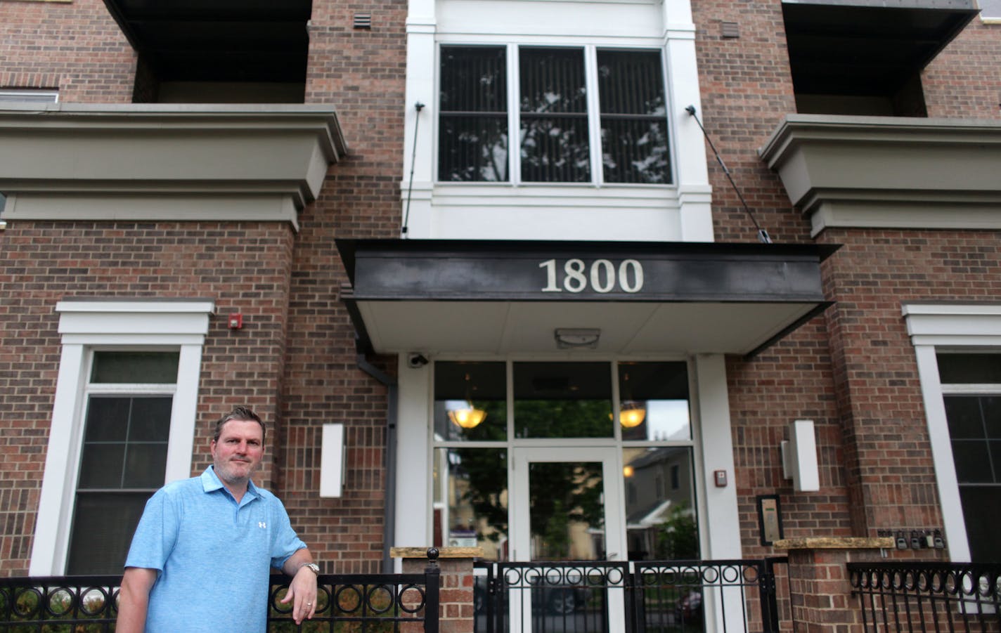 Chris Willette, a real estate agent with Edina Realty, poses for a portrait on Thursday afternoon in front of a building on Clinton Avenue, where he just sold a condo. MONICA HERNDON monica.herndon@startribune.com Minneapolis, MN 06/05/2014