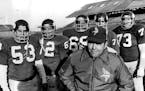 December 24, 1976: Vikings offensive line Coach John Michels and his charges: from left, center Mick Tingelhoff, guards Ed White and Charles Goodrum, 