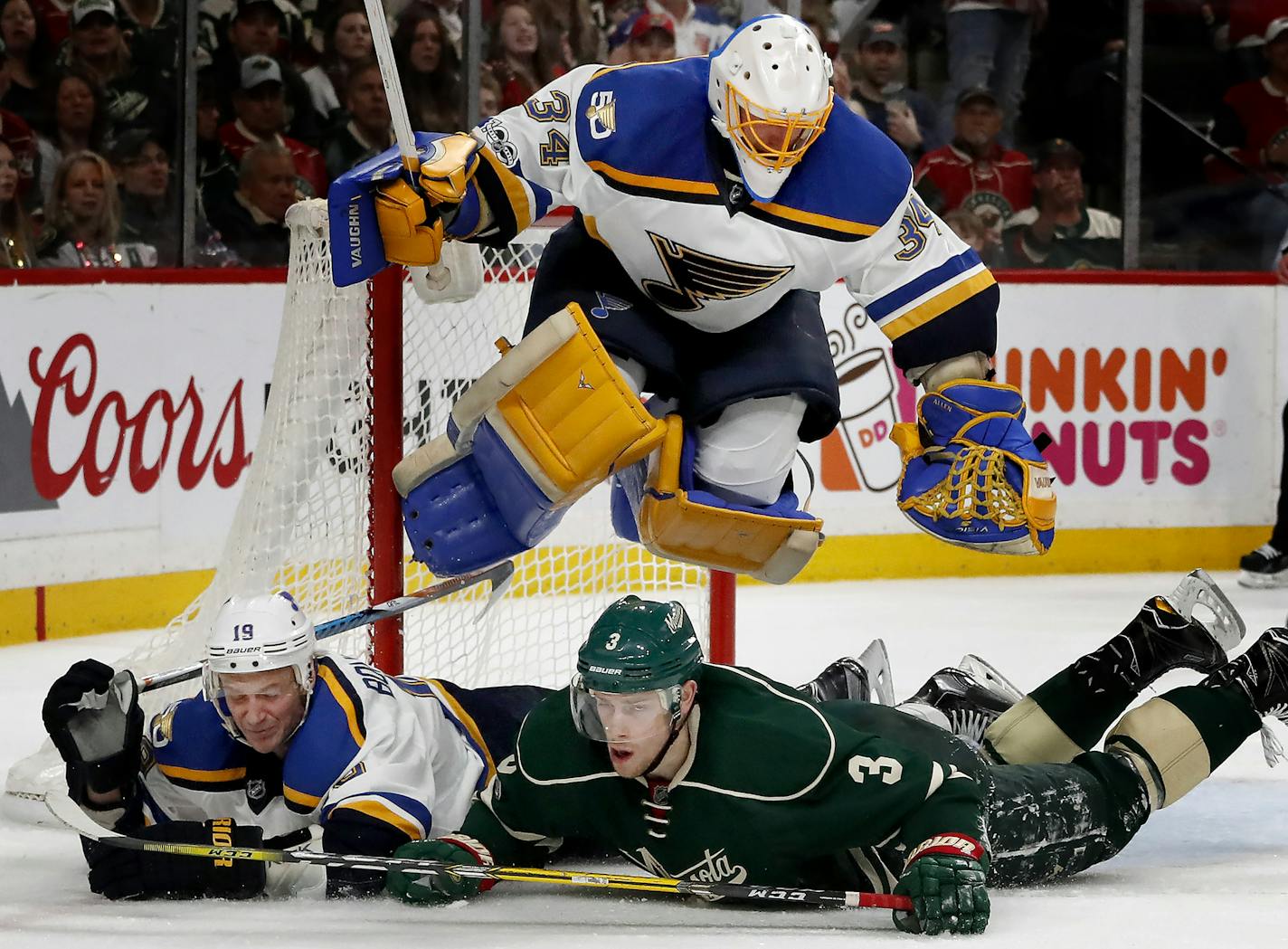 Blues goalie Jake Allen (34) jumped over Jay Bouwmeester (19) and Charlie Coyle (3) in the third period. ] CARLOS GONZALEZ &#xef; cgonzalez@startribune.com - April 14, 2017, St. Paul, MN, Xcel Energy Center, NHL, Stanley Cup Playoffs, Game 2, Minnesota Wild vs. St. Louis Blues