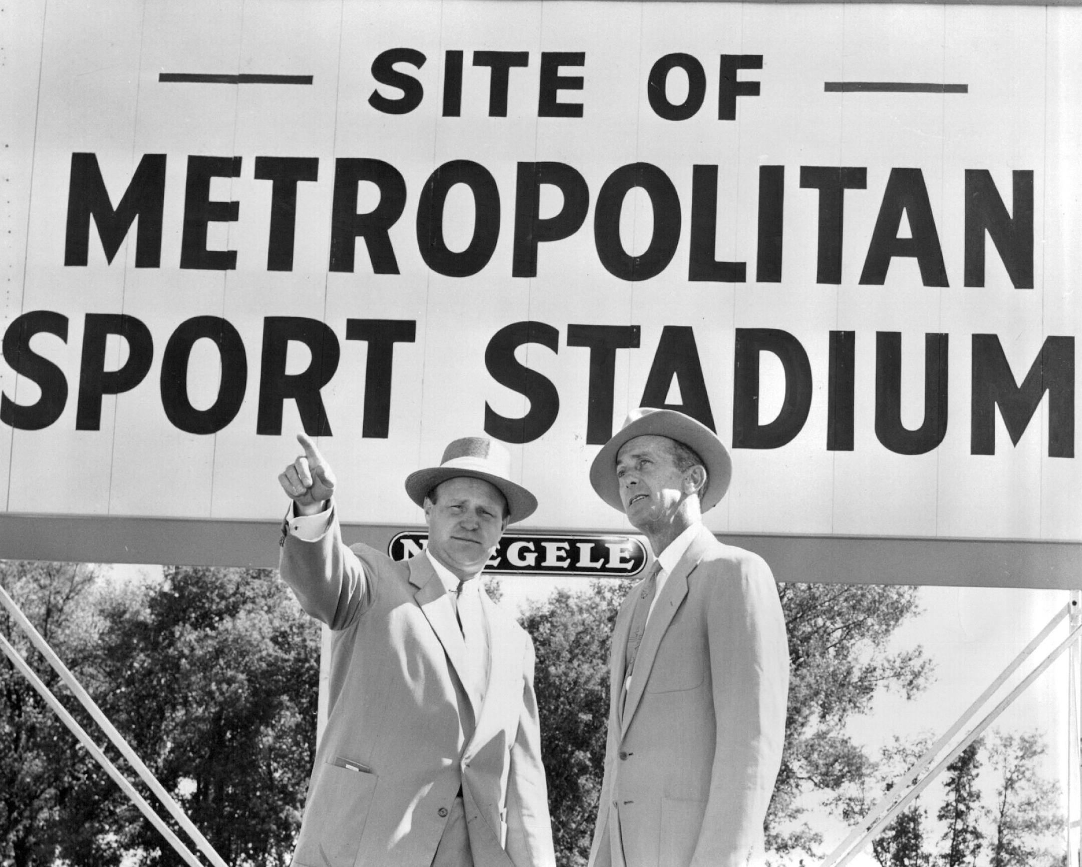 September 7, 1955 Norm McGrew, left, of the Chamber of Commerce Sports and Attractions committee, points out the layout of the Metropolitan sports stadium to Matty Schwab, head groundskeeper at the Polo Grounds in New York. Schwab is here to assist installation of the playing field at the Bloomington park. September 9, 1955 Minneapolis Star Tribune