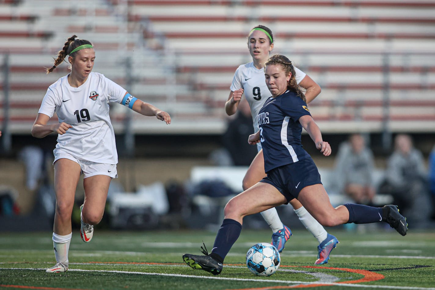 Mahtomedi's Katelyn Beulke (9) wound into her shot on goal late in the first half. Beulke's shot resulted in a goal and a 3-0 Mahtomedi lead. Class 2A girls soccer state tournament quarterfinal, Mahtomedi vs. Winona, 10-25-22. Photo by Mark Hvidsten, SportsEngine