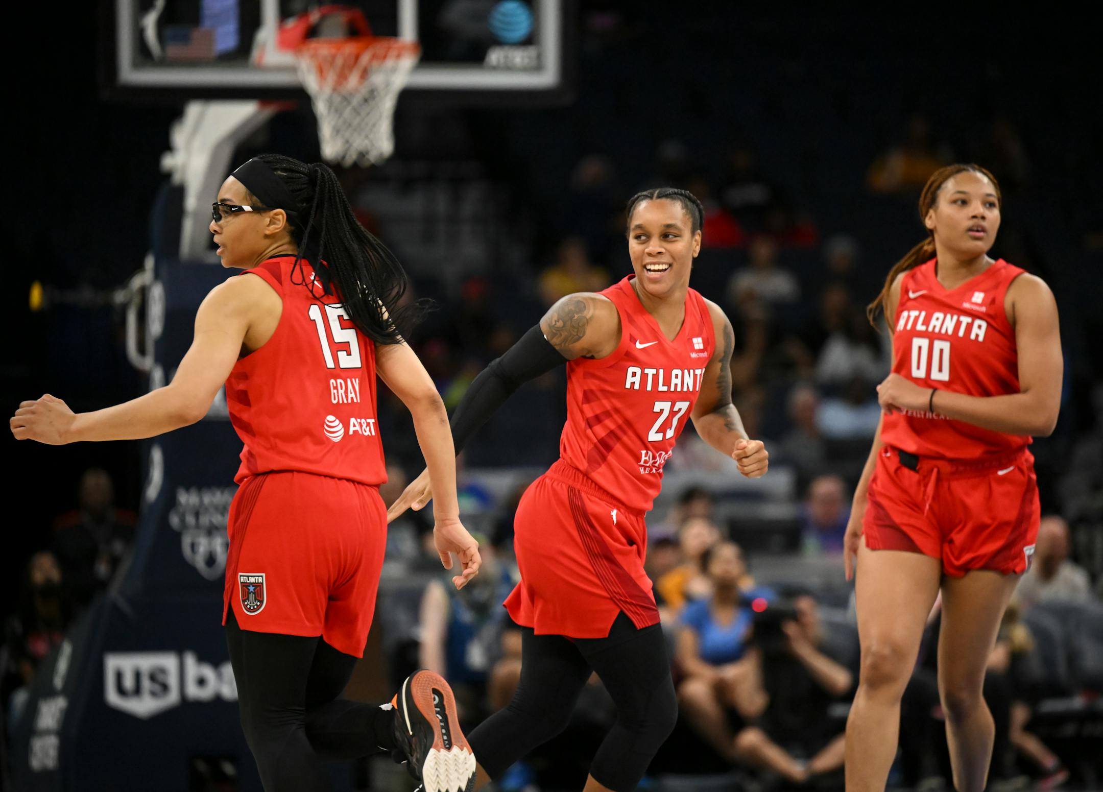 From left, Atlanta Dream guard Allisha Gray, guard AD Durr and forward Naz Hillmon celebrate a 3-pointer by Durr in the third quarter.