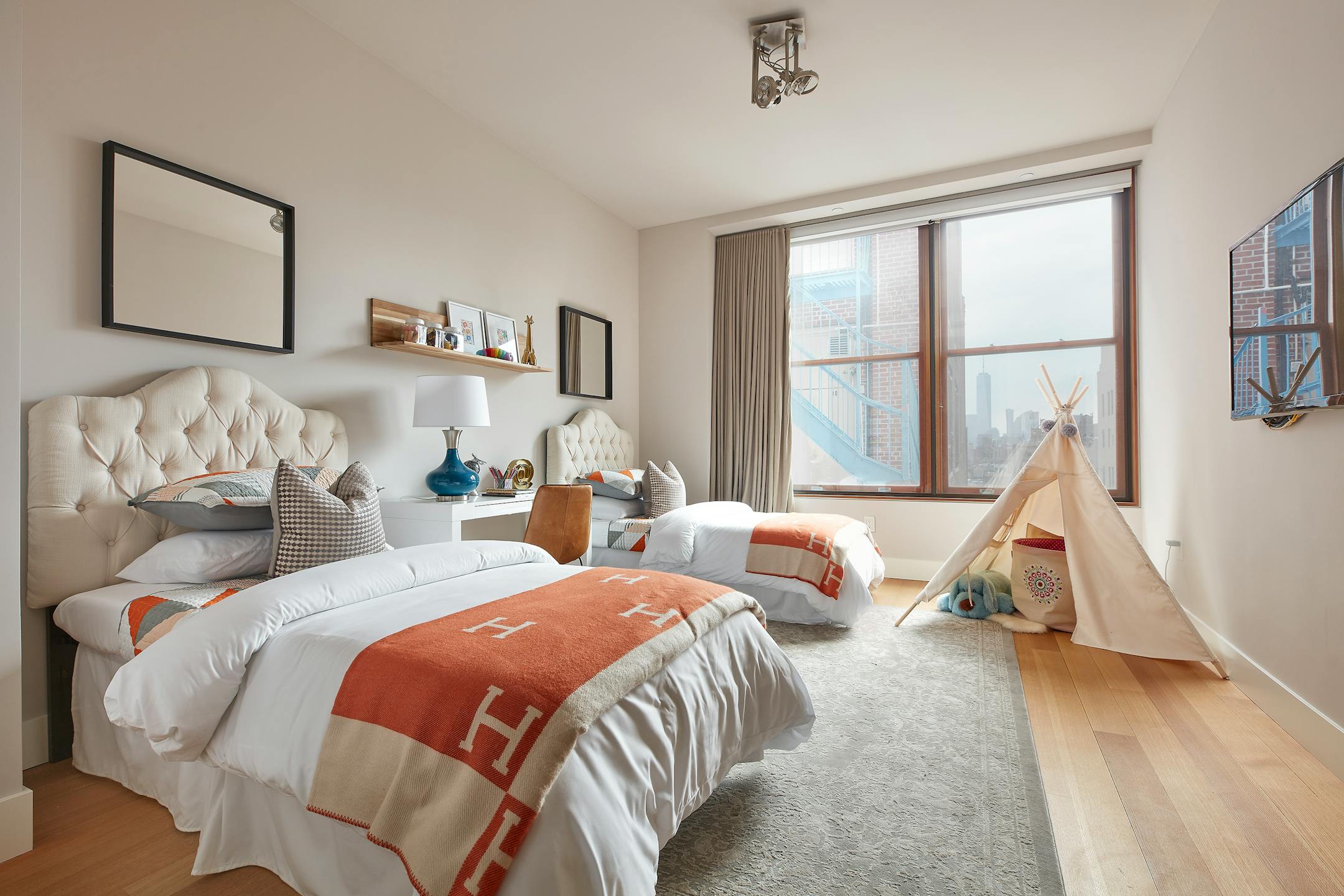 Orange has gender-neutral appeal in this bedroom. (Scott Gabriel Morris/Provided photo/TNS)