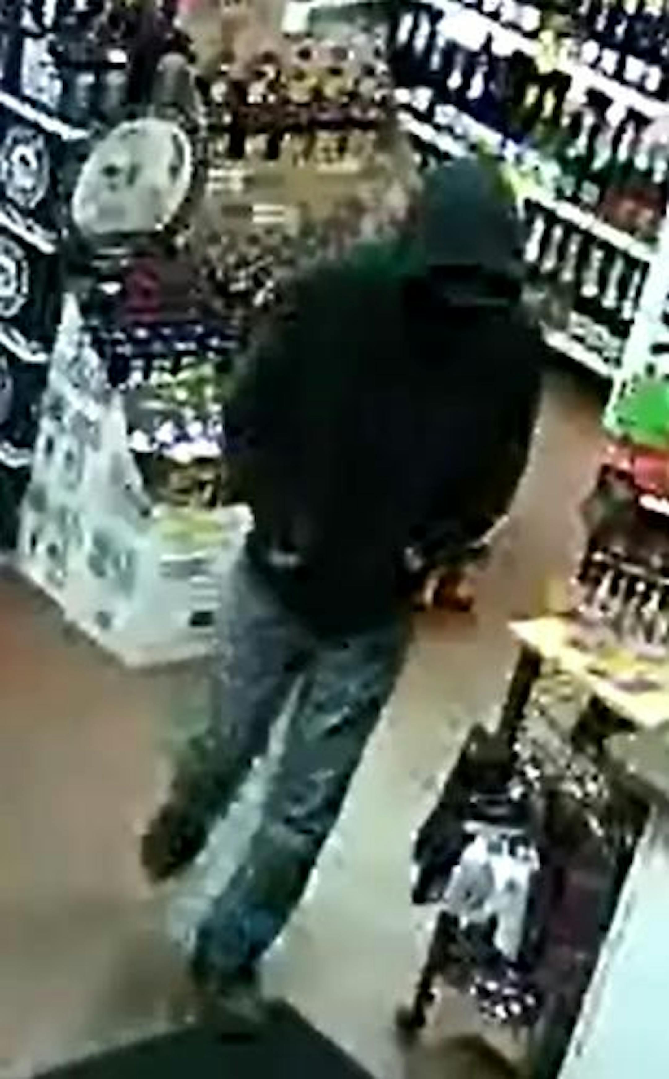 Police are looking for this man, suspected of eight robberies since late September in the north metro. These images show him in a liquor store.