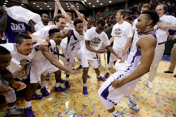 Stephen F. Austin's Trey Pinkney, right, dances as he celebrates with teammates after an NCAA college basketball game against Sam Houston State in the