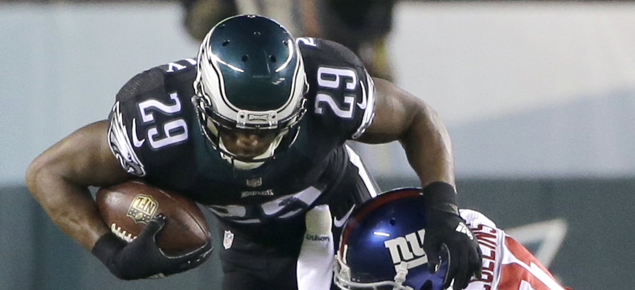 New York Giants free safety Landon Collins (21) makes the hit on Philadelphia Eagles running back DeMarco Murray (29) during the first half of an NFL football game, Monday, Oct. 19, 2015, in Philadelphia. (AP Photo/Matt Rourke)