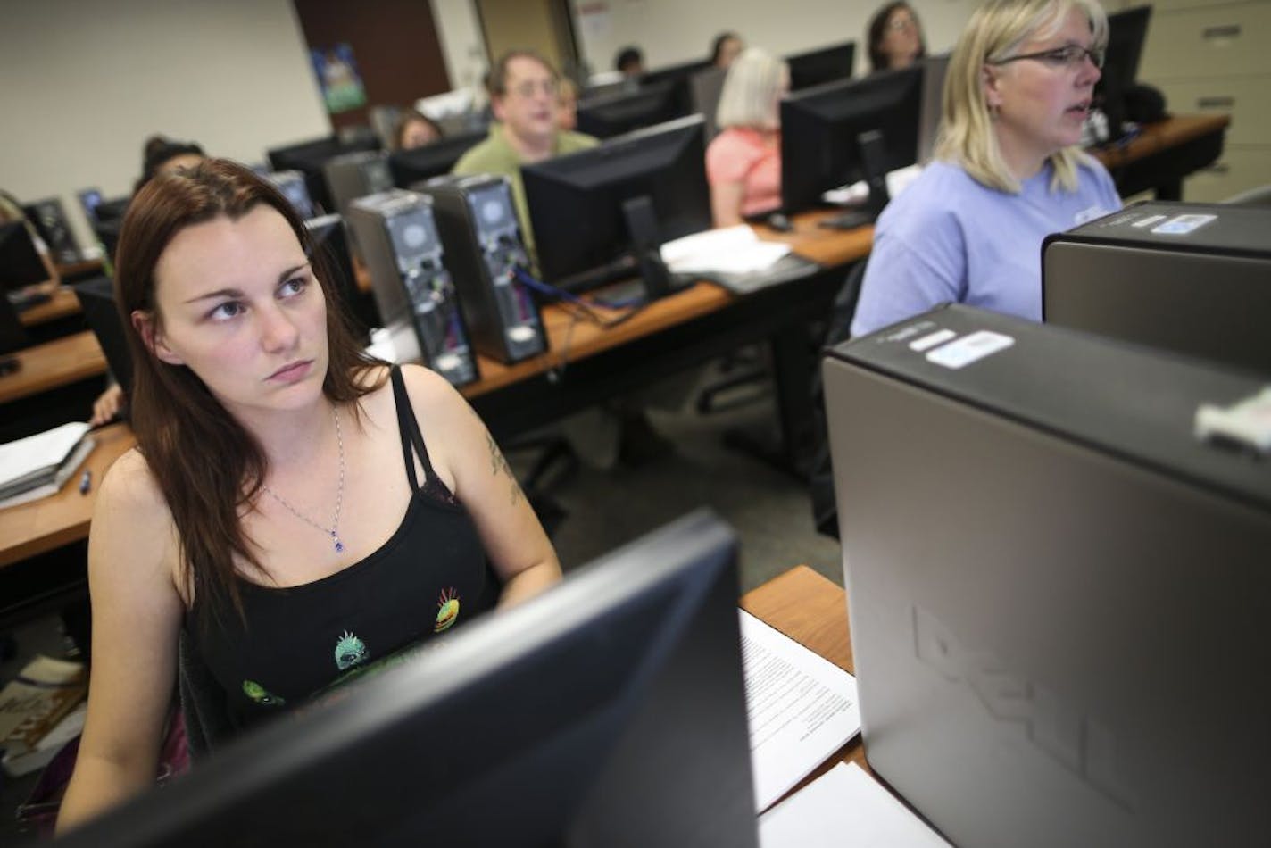 Lindsay Peterson, 28, of St. Paul, listened during her advanced medical coding class at St. Paul College on Wednesday, June 20, 2012 in St. Paul, Minn. She is getting her certificate in coding.