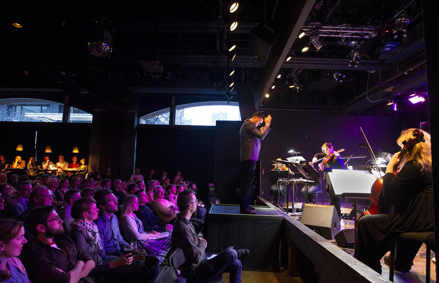 Daniel Bjarnason conducts the musicians of the Minneapolis Music Company at the Amsterdam Bar and Hall in St. Paul May 6, 2014. The event was presented by the Saint Paul Chamber Orchestra's Liquid Music Series. (Courtney Perry/Special to the Star Tribune)