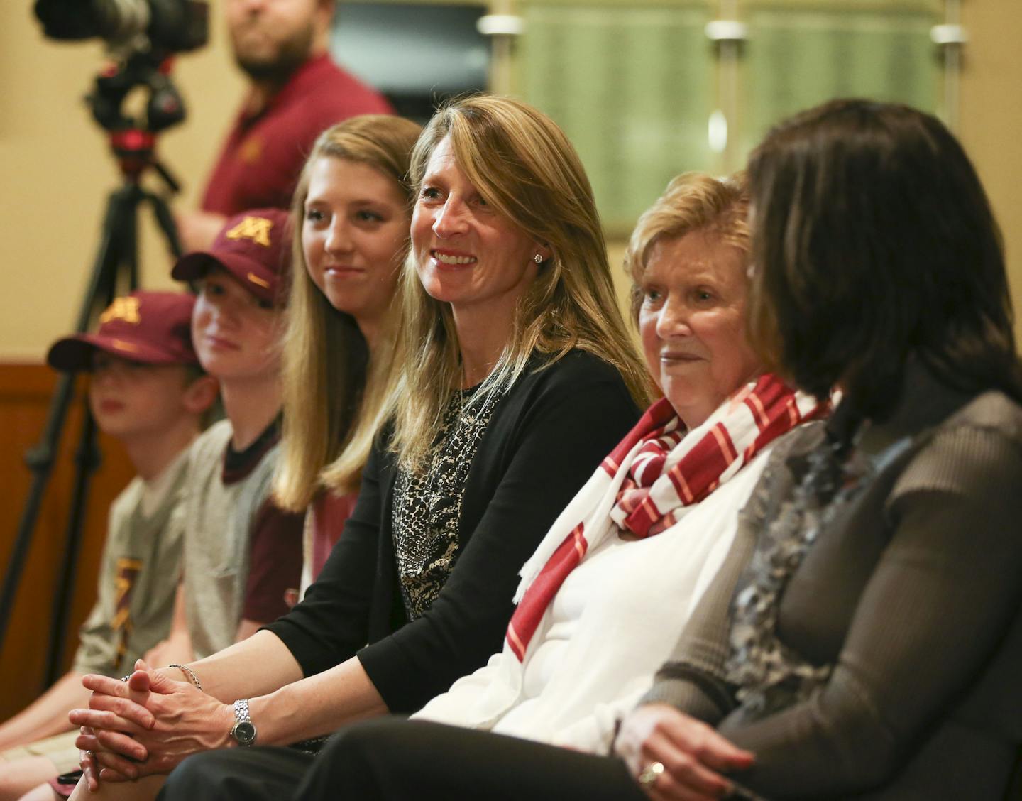 New University of Minnesota Athletic Director Mark Coyle's family watched as he answered questions at the news conference following his introduction Wednesday afternoon at TCF Bank Stadium. They are, from left, sons Benjamin, 9, and Nicholas, 12, daughter Grace 14, his wife, Krystan Coyle, his mother, Donna Coyle, and a sister, right. ] JEFF WHEELER &#xef; jeff.wheeler@startribune.com Former Syracuse Athletic Director Mark Coyle was introduced as the new AD at the University of Minnesota at a ne