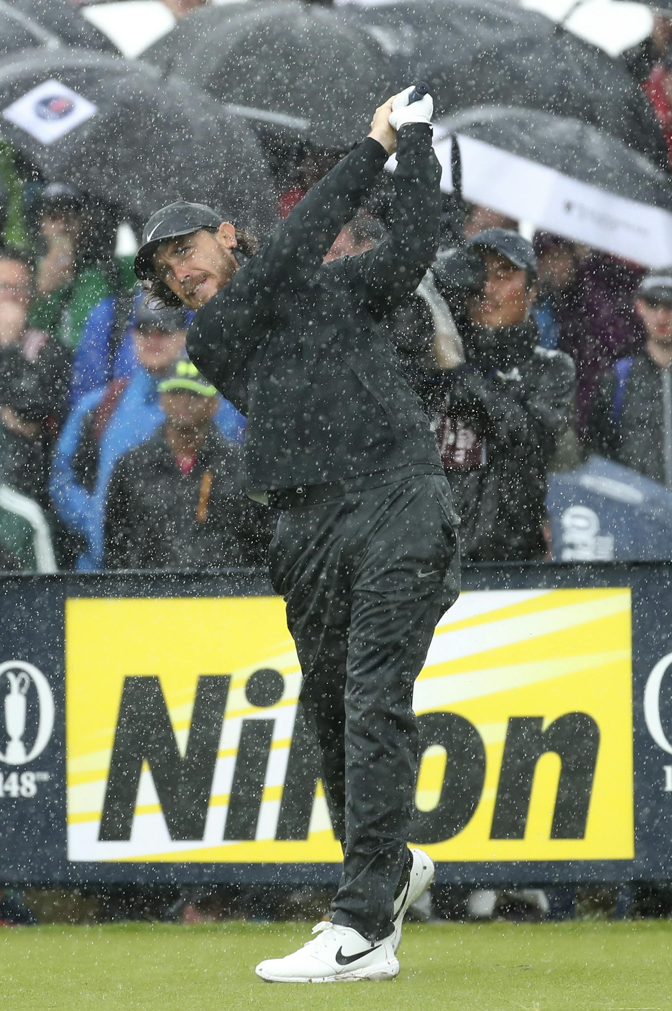 England's Tommy Fleetwood tees off the 9th tee hole in heavy rain during the final round of the British Open Golf Championships at Royal Portrush in Northern Ireland, Sunday, July 21, 2019.(AP Photo/Peter Morrison)