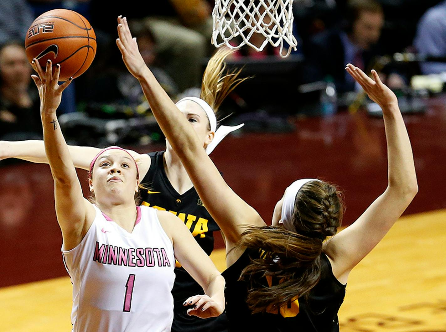 Gophers guard Rachel Banham, shown attempting a shot against Iowa on Feb. 15, scored 52 points in a 114-106 loss to Michigan State on Sunday.