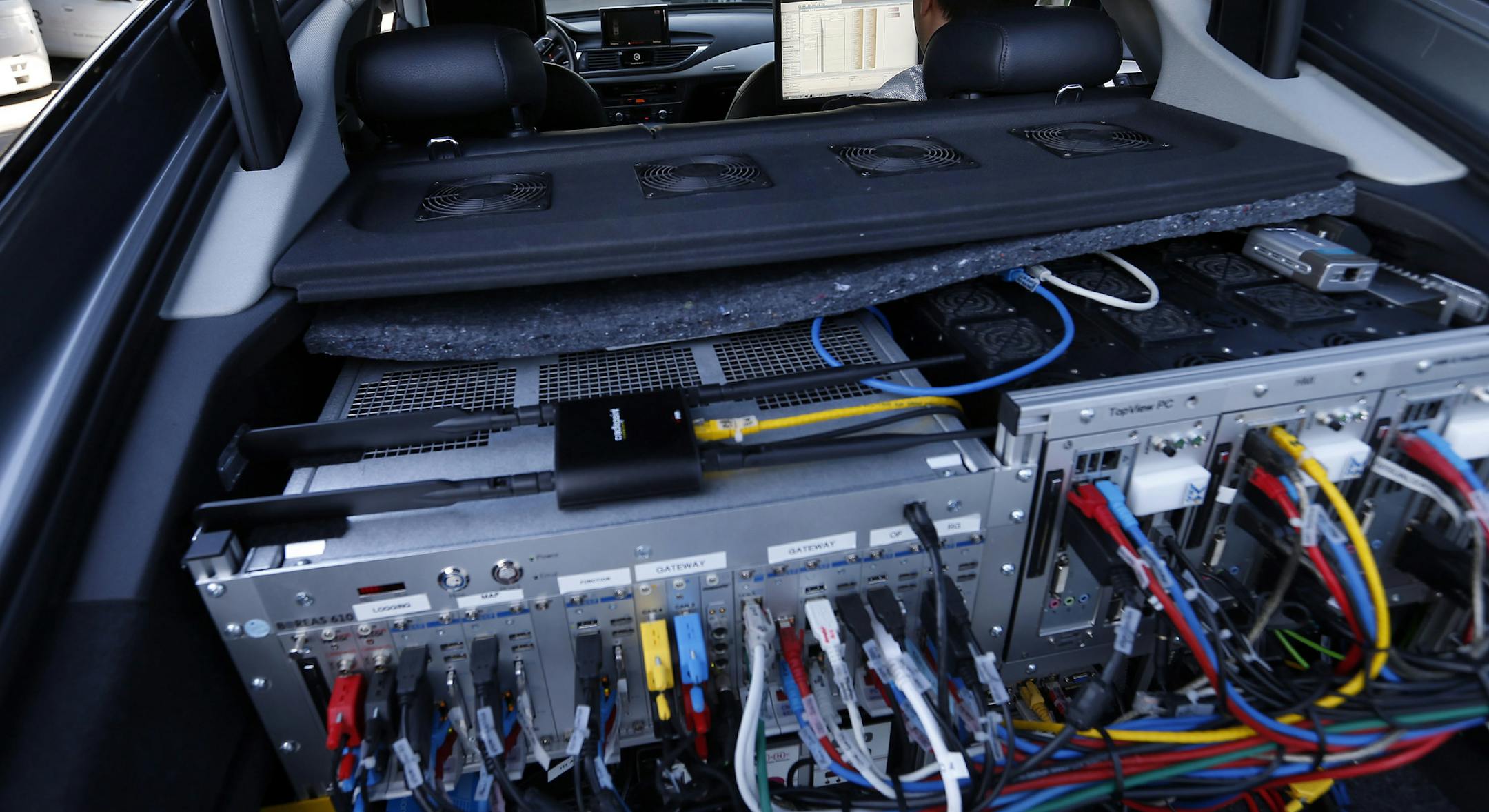 Computer gear fills the back hatch of an autonomous Audi A7 under development at the Volkswagen Group Electronics Research Laboratory Monday afternoon, March, 30, 2015, in Belmont, Calif. (Karl Mondon/Bay Area News Group/TNS) ORG XMIT: 1167314