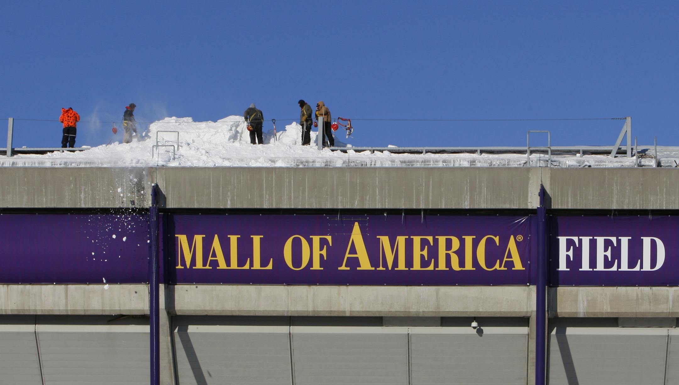 Workers shovel snow off the roof of Mall of America Field at the Hubert H. Humphrey Metrodome in Minneapolis Sunday, Dec. 12, 2010. The inflatable roof of the Metrodome collapsed Sunday after a snowstorm that dumped 17 inches on Minneapolis. No one was hurt, but the roof failure sent the NFL scrambling to find a new venue for the Vikings' game against the New York Giants.
