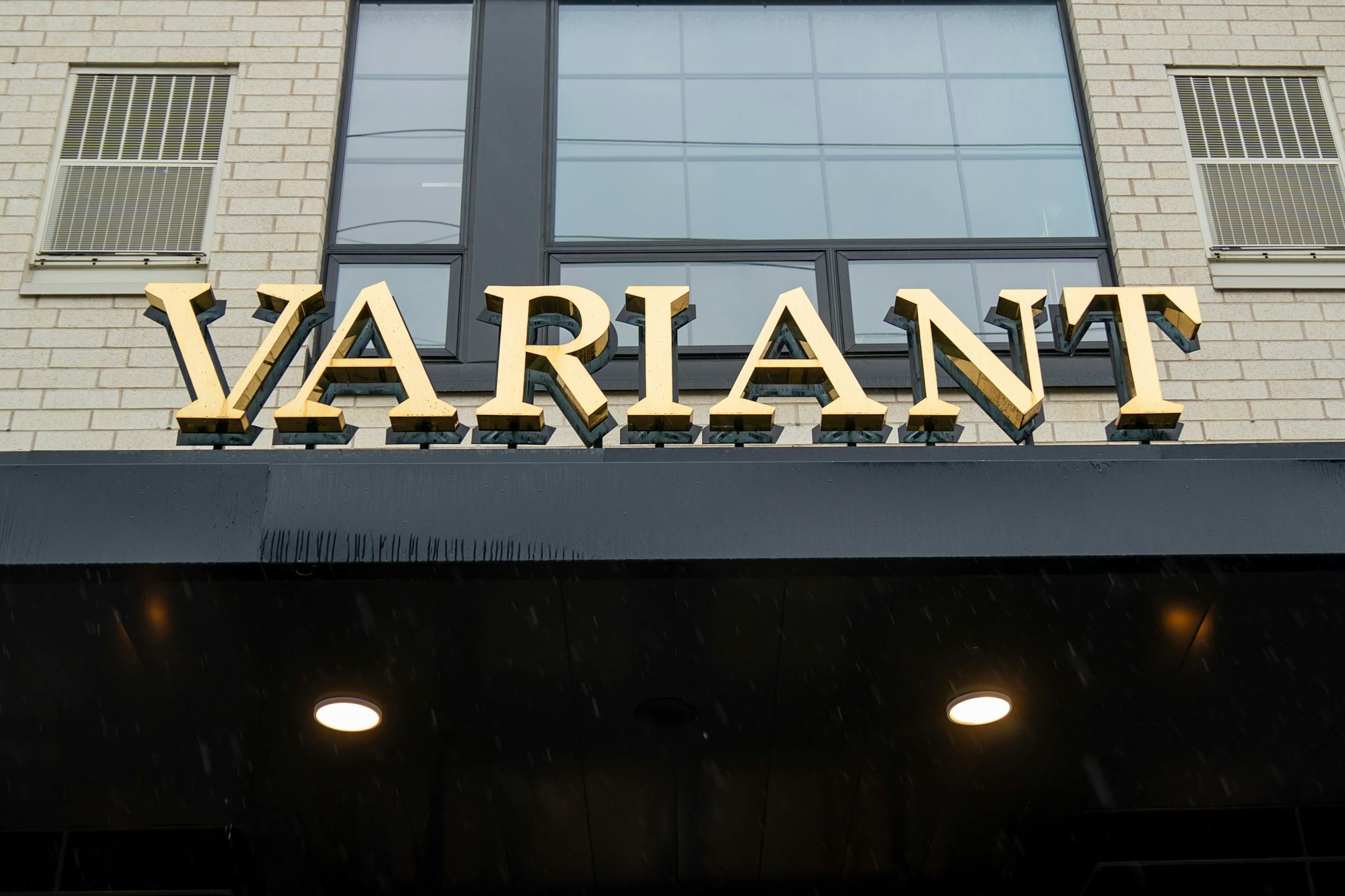 Variant has name on marble lobby desk and white-brick exterior was intended to make the building look very "different" from its neighbors.: https://www.variantmpls.com/ Address: 315 N 7th Ave, Minneapolis, MN 55401