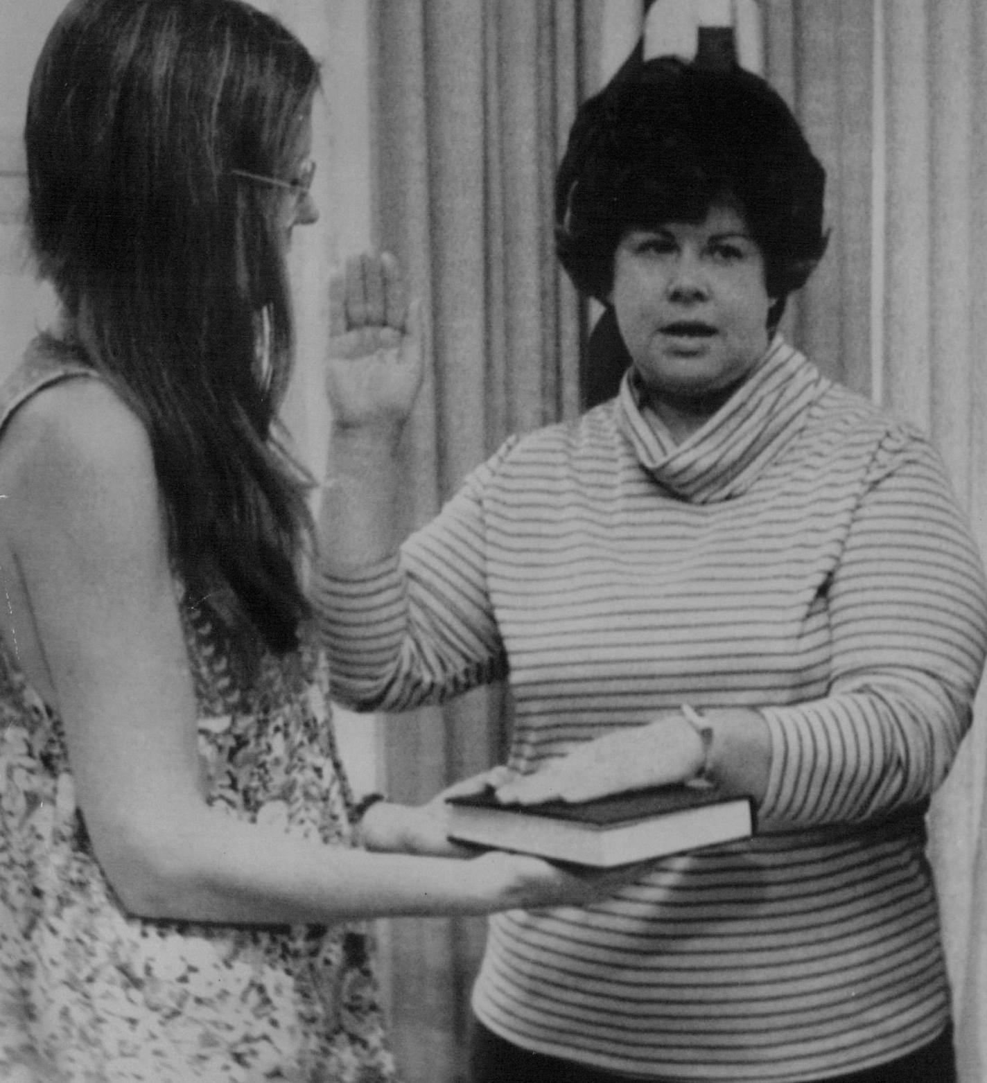 August 13, 1977 Koryne Horbal, Columbia Heights, center, took the oath as representative the Commission on Status of Women of the Social an "Economic Council the United Nations yesterday. Gloria Stelnem, Ms. Magazine editor, held the Bible as U.N.* Ambassador Andrew Young administered the oath at the U.S. mission to the United Nations in New York.