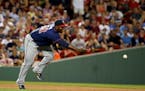 Minnesota Twins third baseman Miguel Sano tosses the ball to second during a baseball game against the Boston Red Sox at Fenway Park, Thursday, July 2