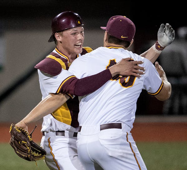Gophers pitcher Fred Manke (40) got a hug from catcher Eli Wilson (4) at the end of the game. Minnesota beat UCLA 13-8 to advance to the Super Regiona