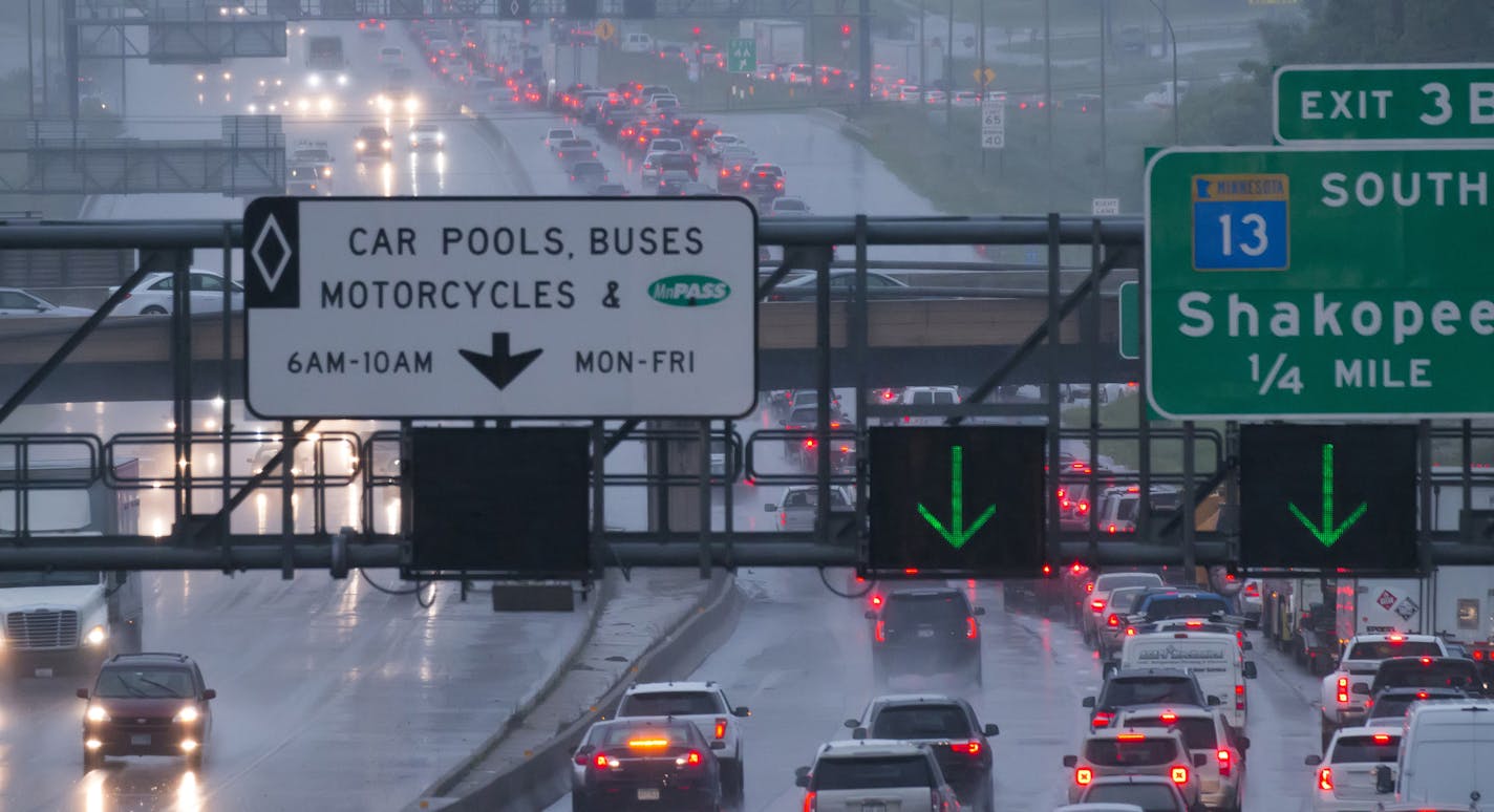 Heavy rain soaked the metro area Monday morning, messing with the commute and bringing with it high winds. Here, traffic was at a stand still on I-35W northbound heading across the Minnesota River at about 8:45 Monday morning. ] Brian.Peterson@startribune.com Burnsville, MN - 6/22/2015 ORG XMIT: MIN1506221051570442 ORG XMIT: MIN1605111210501027 ORG XMIT: MIN1608051225440045