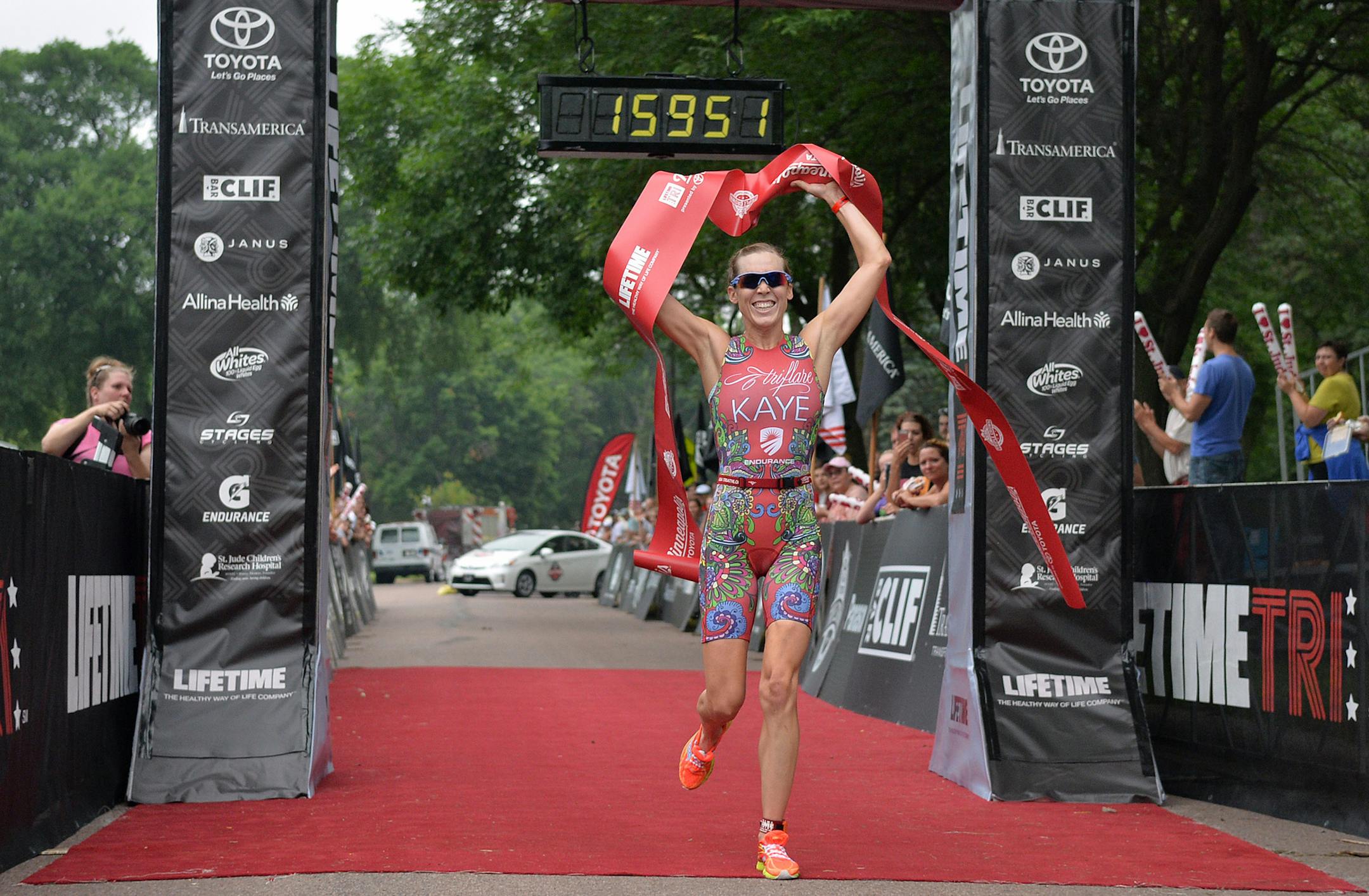 Professional triathlete Alicia Kaye, 31, finishes the last steps of the 12th annual Life Time triathlon Saturday morning at Lake Nokomis. Kaye placed first in the women's professional division with a time of 1:59:51.48 ] (SPECIAL TO THE STAR TRIBUNE/BRE McGEE) **Alicia Kaye (triathlete, 31)