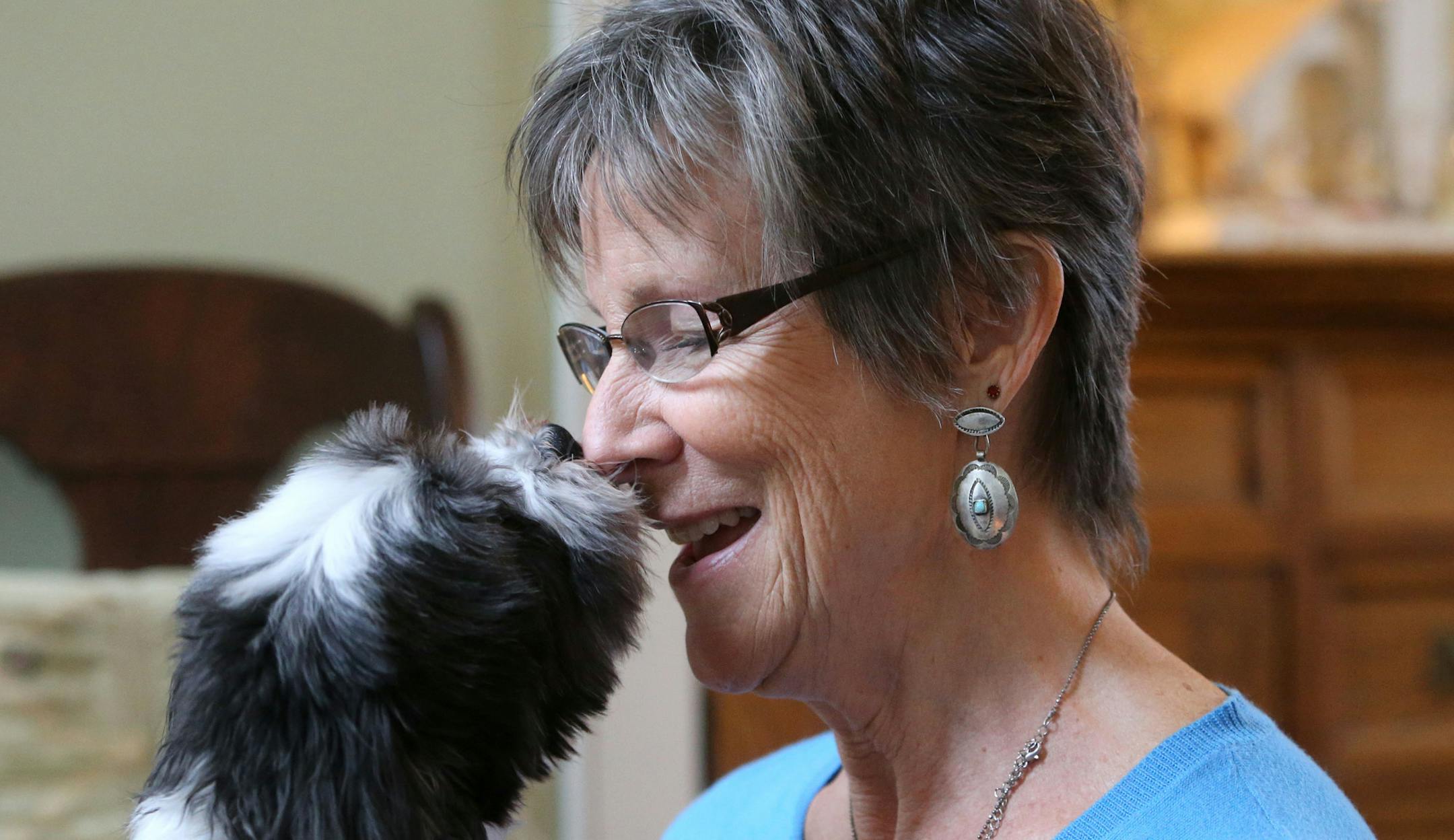 Sue Bohlmann was a longtime owner of Golden Retrievers and decided to go small because of health concerns. Bohlmann was seen with her dog Mateo, a male 8 year-old Havanese, giving some affection at her Minnetonka home Wednesday, Dec. 2, 2015, in Minnetonka, MN. ](DAVID JOLES/STARTRIBUNE)djoles@startribune.com Aging Boomers are starting to wonder whether it's time to downsize their dogs.