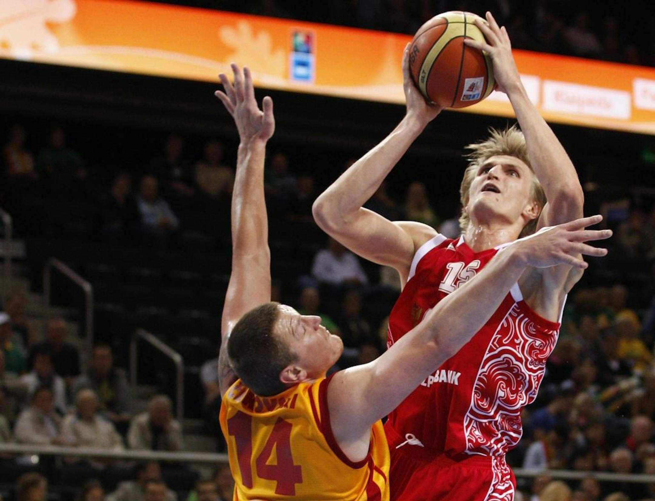 FILE - This Sept. 18, 2011 file photo shows Russia's Andrei Kirilenko going to the basket against a Macedonian defender during the European Basketball Championship bronze match against in Kaunas, Lithuania. The Minnesota Timberwolves have signed free agent Kirilenko, bringing the versatile forward back to the NBA after a one-season absence.