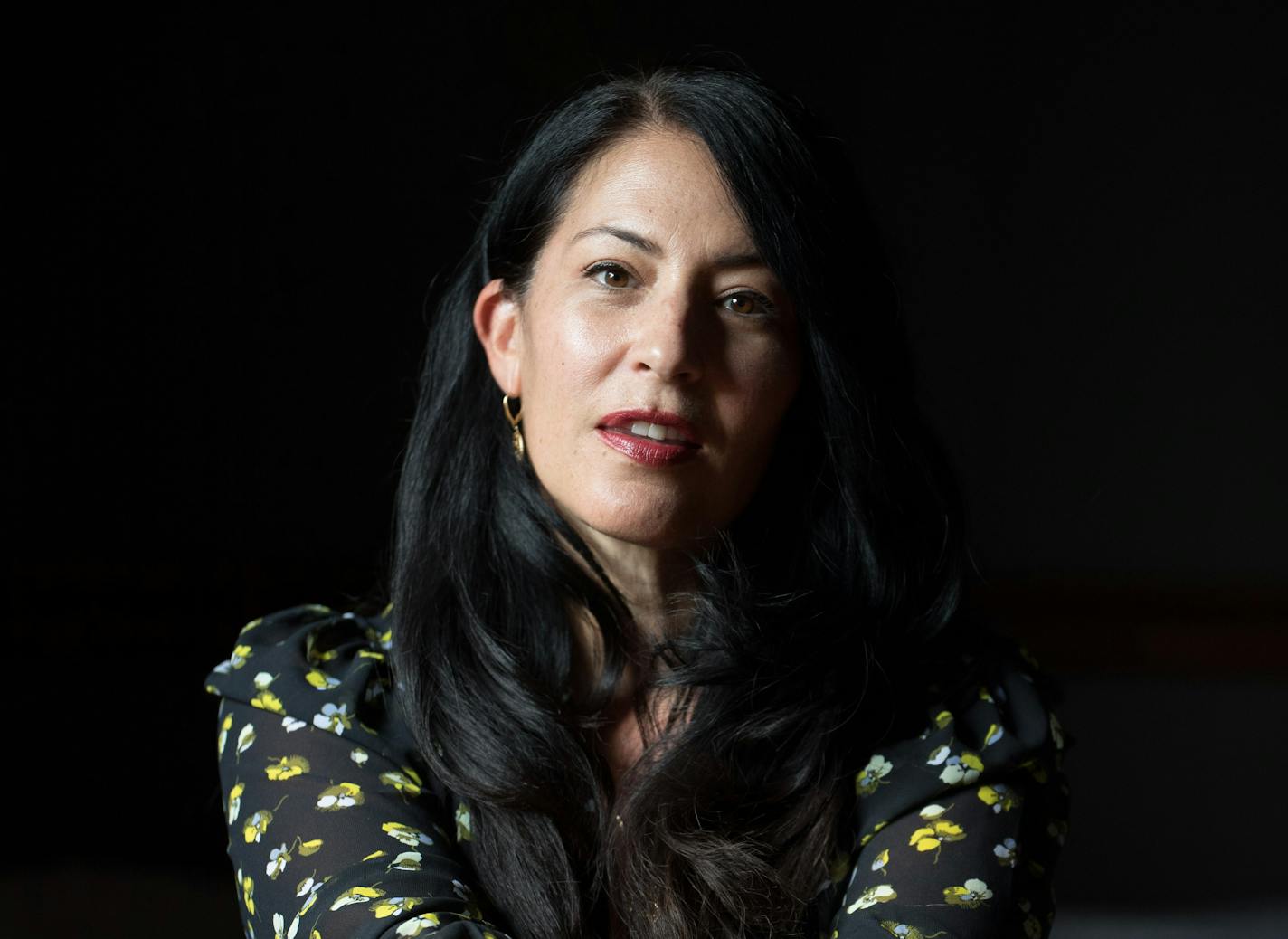 photo of poet Ada Limón  in a black, flowered shirt