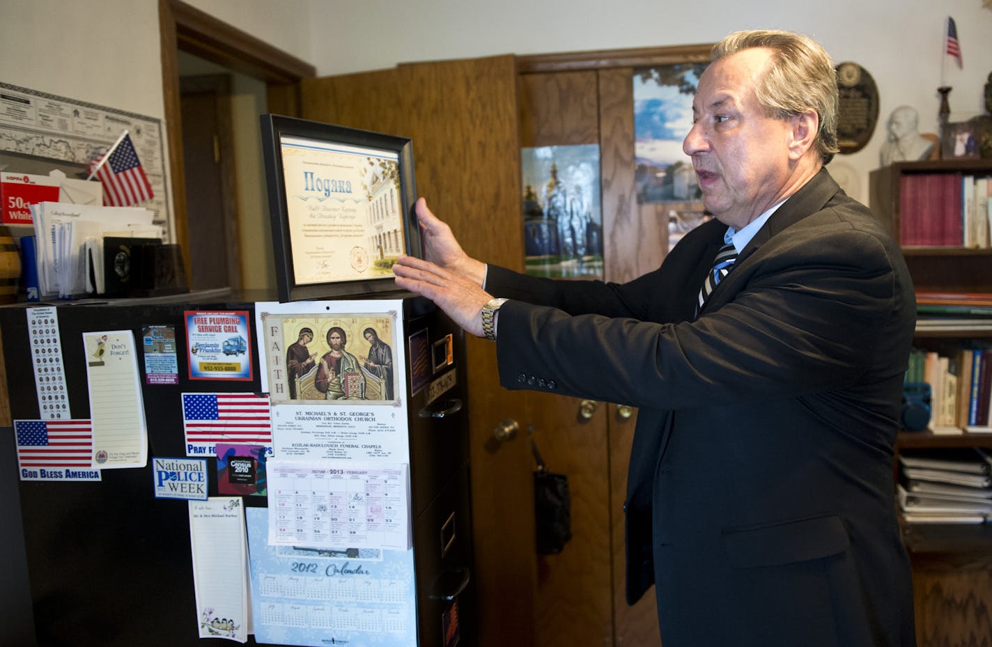 Andrij Karkoc defended his father 94-year-old Michael Karkoc against charges that he was a war criminal and committed atrocities working with the Nazi SS. Andrij showed items in his parents Minneapolis home to show his father's strong ties to the Ukrainian and to the U.S. Wednesday, July 10, 2013 ] GLEN STUBBE * gstubbe@startribune.com