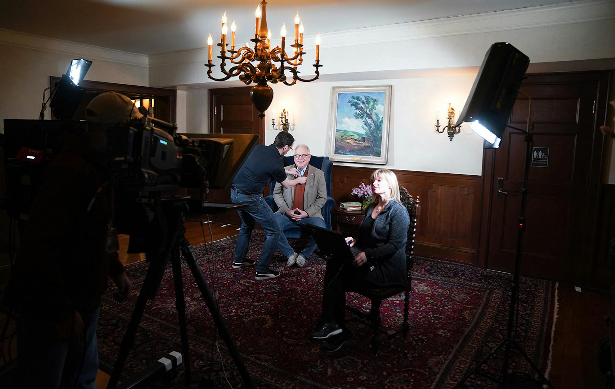 Minnesota Gov. Tim Walz prepared to deliver his State of the State address over YouTube from his residence. At right is prompter operator Laura Hammerbeck.