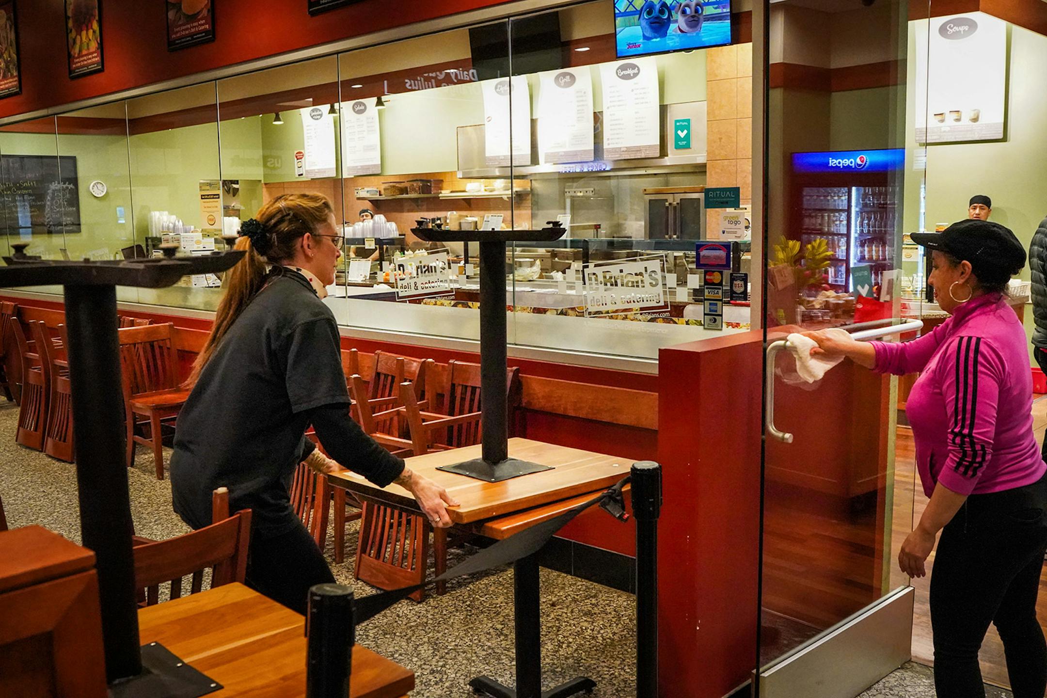 D.Brian's catering coordinator Tammy Susizk moved tables into the seating area entrance so no one could enter. A few people were still moving around in downtown Minneapolis but nothing near the lunch hour weekday crowds.