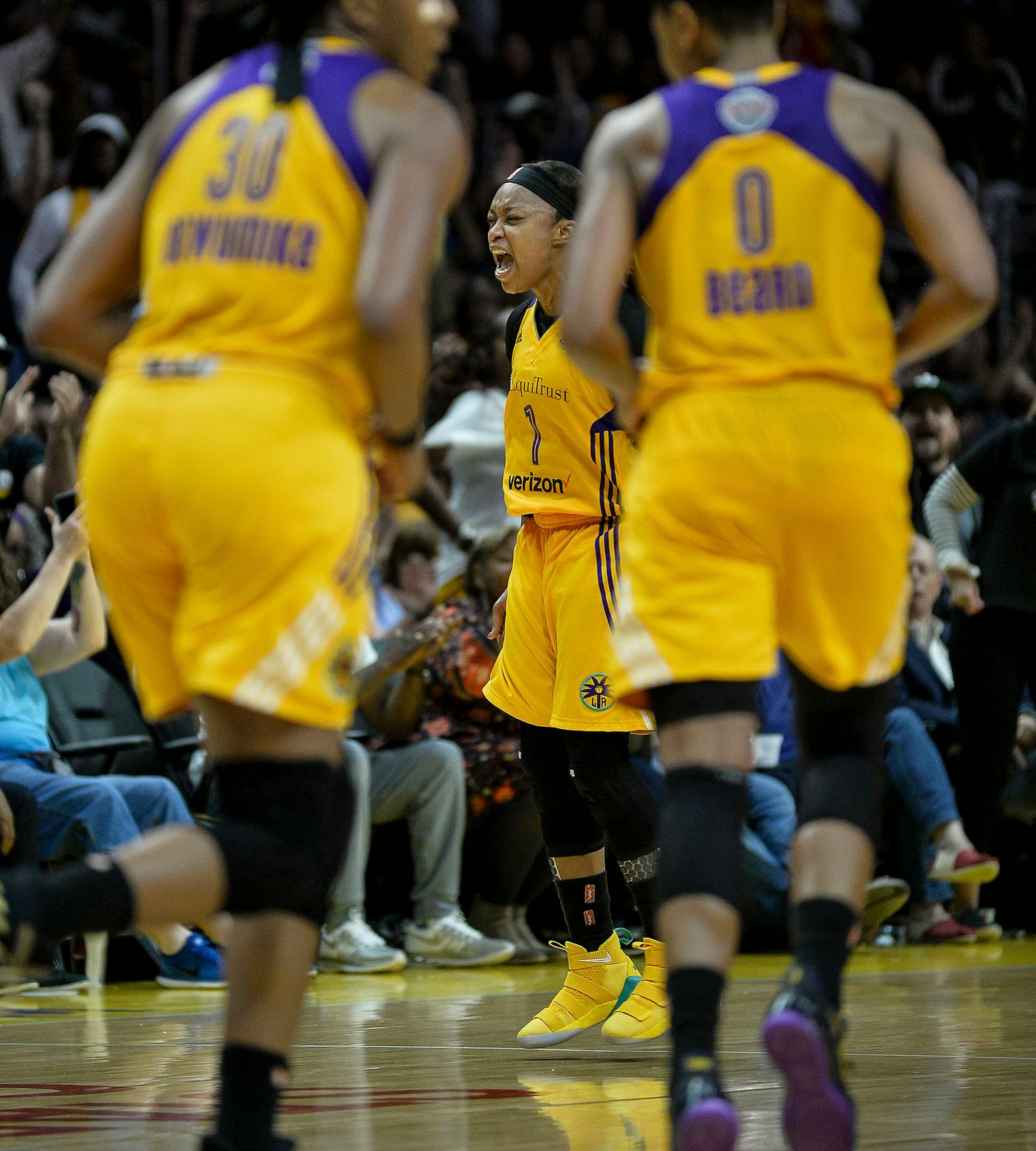 Los Angeles Sparks guard Odyssey Sims (1) celebrated after hitting a 3-pointer in the fourth quarter.