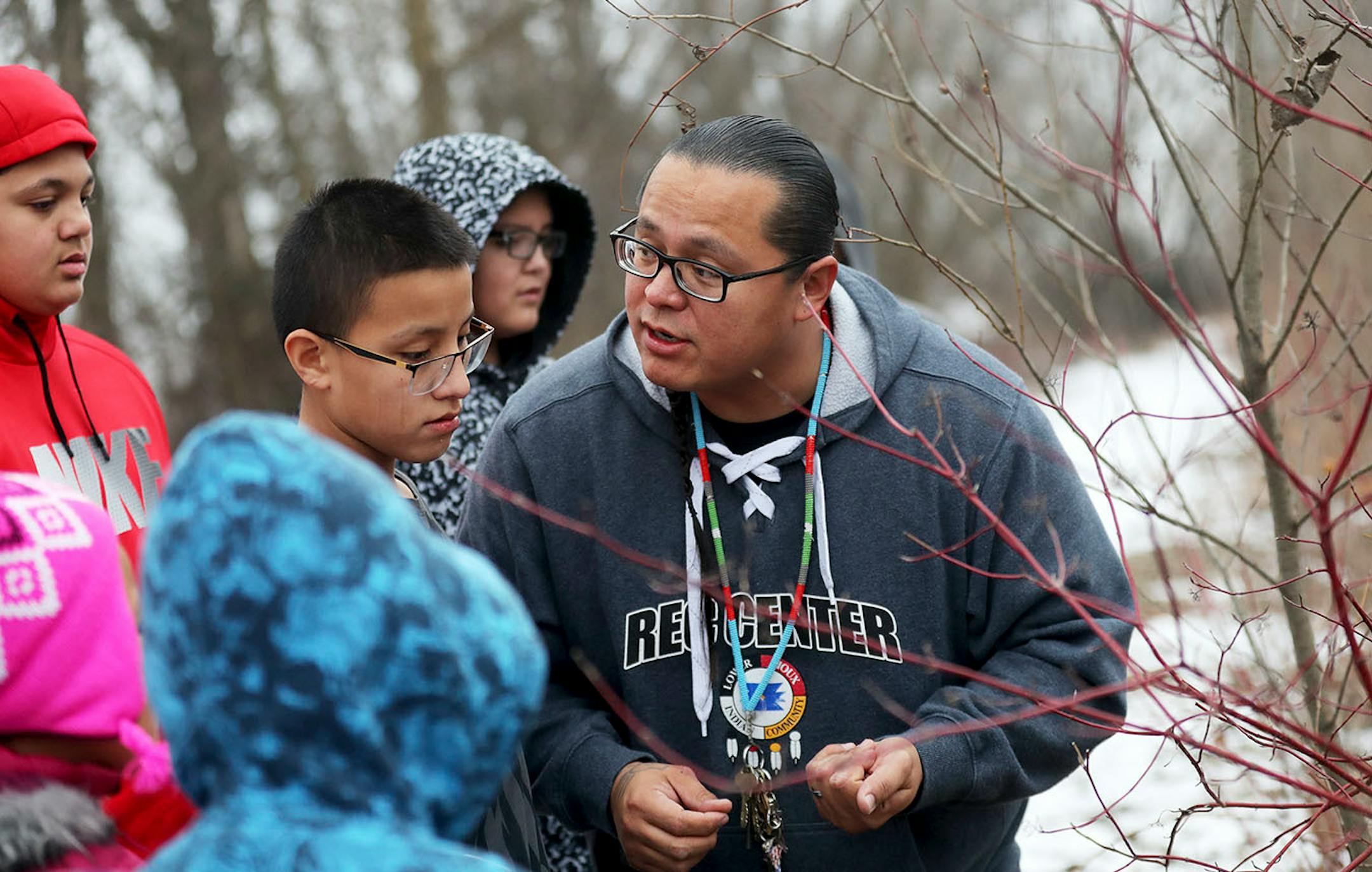 Teacher Mat Pendleton, who holds multiple positions with the Lower Sioux Community, explains how they will leave a tobacco offering near the trees before they begin to harvest any.