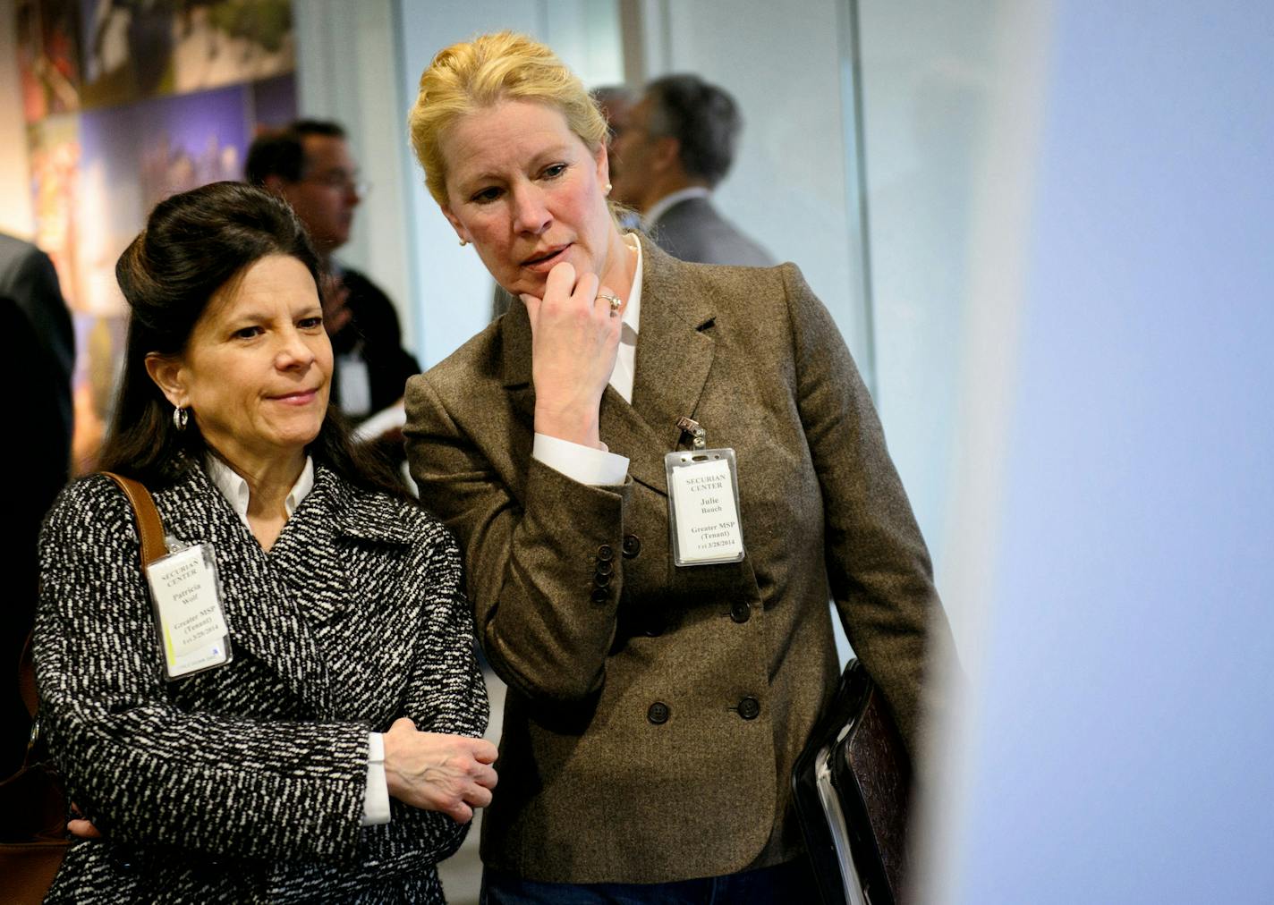 Pat Wolf and Julie Bauch who both work in commercial real estate in St Paul looked over some of the architect renderings of what St. Paul redevelopment might look like. St. Paul Mayor Chris Coleman announced a redevelopment plan for St. Paul. ] GLEN STUBBE * gstubbe@startribune.com Friday, March 28, 2014.