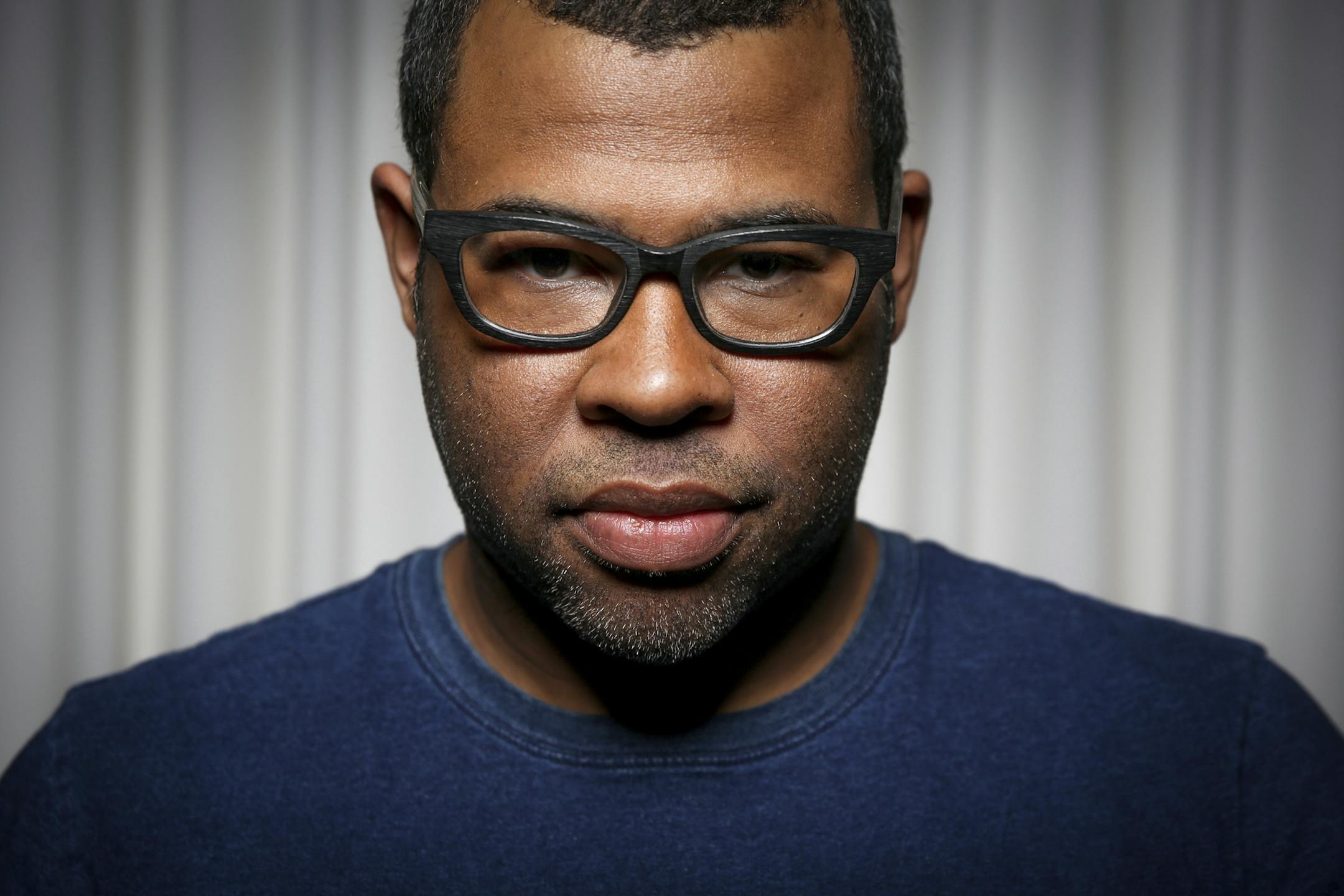 In this Thursday, Feb. 9, 2017 photo, Jordan Peele poses for a portrait at the SLS Hotel in Los Angeles. Peele's directorial debut, "Get Out," in theaters Friday, Feb. 24, is one of those rare creations that functions both as a taut psychological thriller and as searing social commentary about racism in the modern era. (Photo by Rich Fury/Invision/AP)