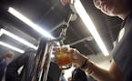 Glasses of Fulton IPA were poured during the grand opening of the Fulton microbrewery selling growlers at its location in Minneapolis in 2011.