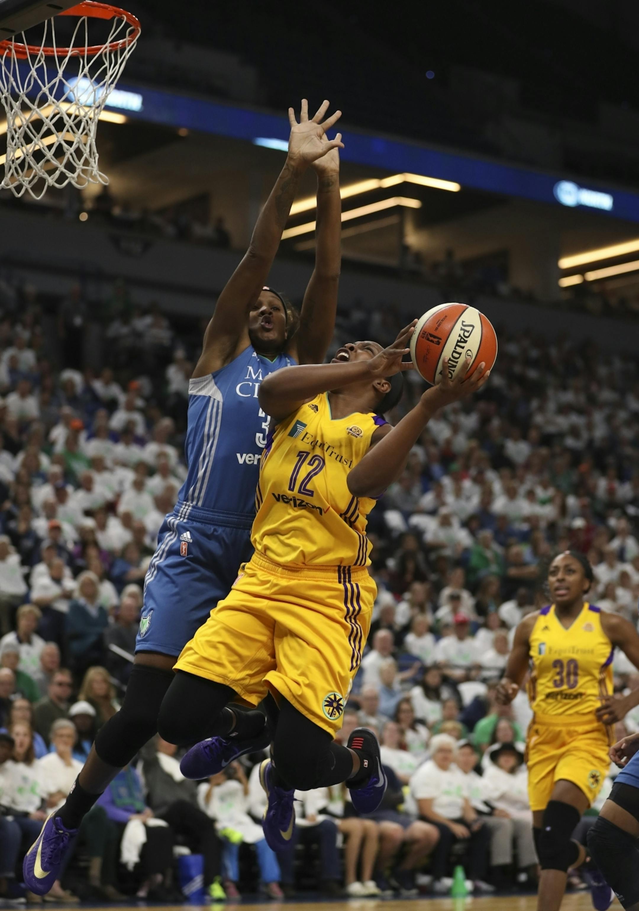 Los Angeles Sparks guard Chelsea Gray (12) was fouled in the second quarter by Minnesota Lynx forward Rebekkah Brunson (32).