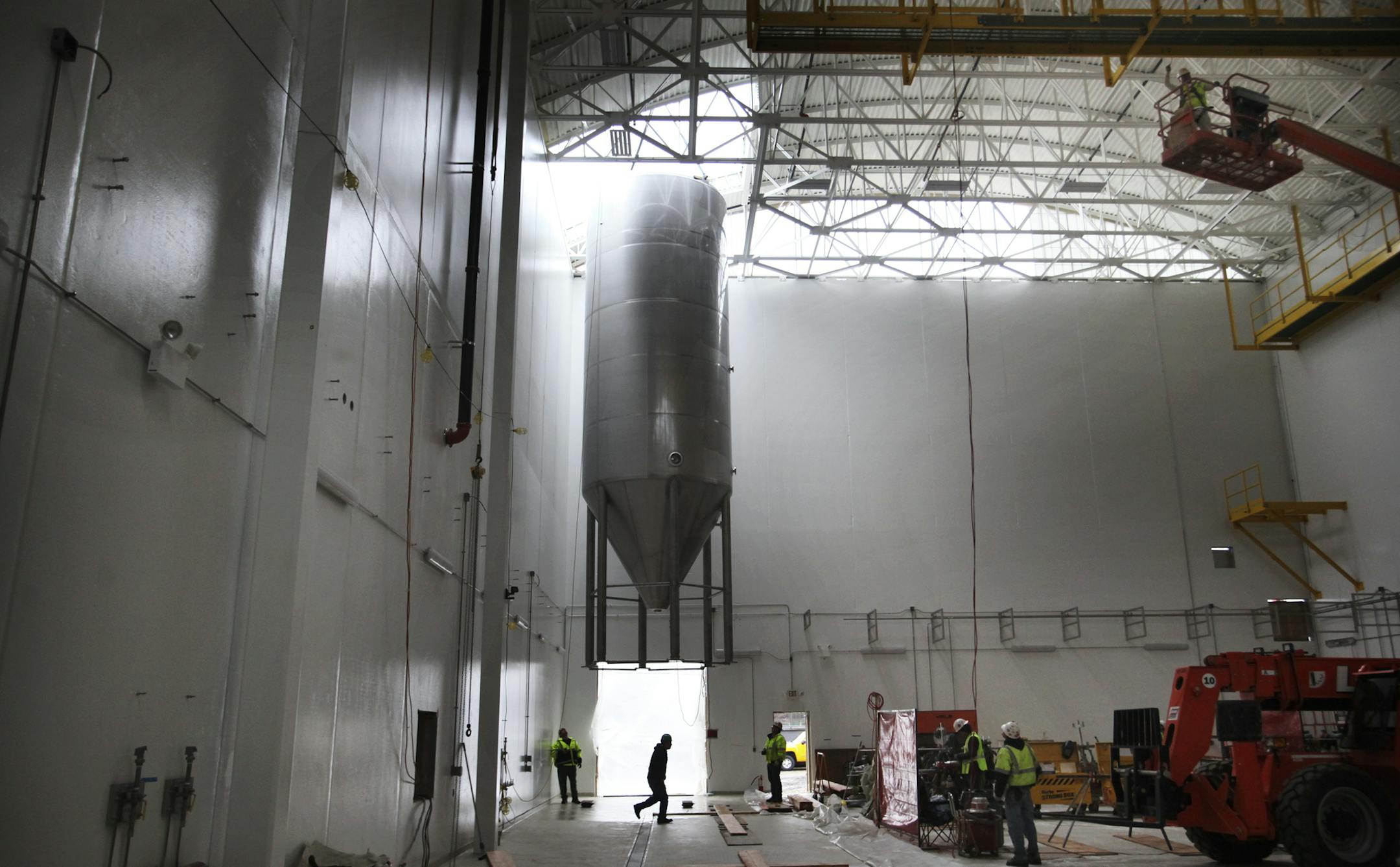 Summit Brewing's $13 million expansion continued Wednesday as giant fermentation tanks were lowered by crane into Summit's new cellar in St. Paul.