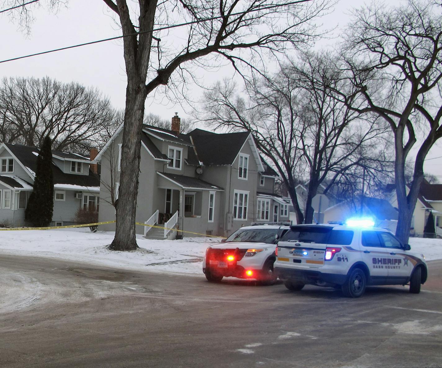 Two Cass County sheriff's deputies secure an area in North Fargo, N.D., on Thursday, Feb. 11, 2016 one block from a house where a suspect is accused of shooting a police officer. Officer Jason Moszer was shot during a standoff with a domestic violence suspect and is not expected to survive authorities in Fargo said Thursday. (AP Photo/Dave Kolpack)