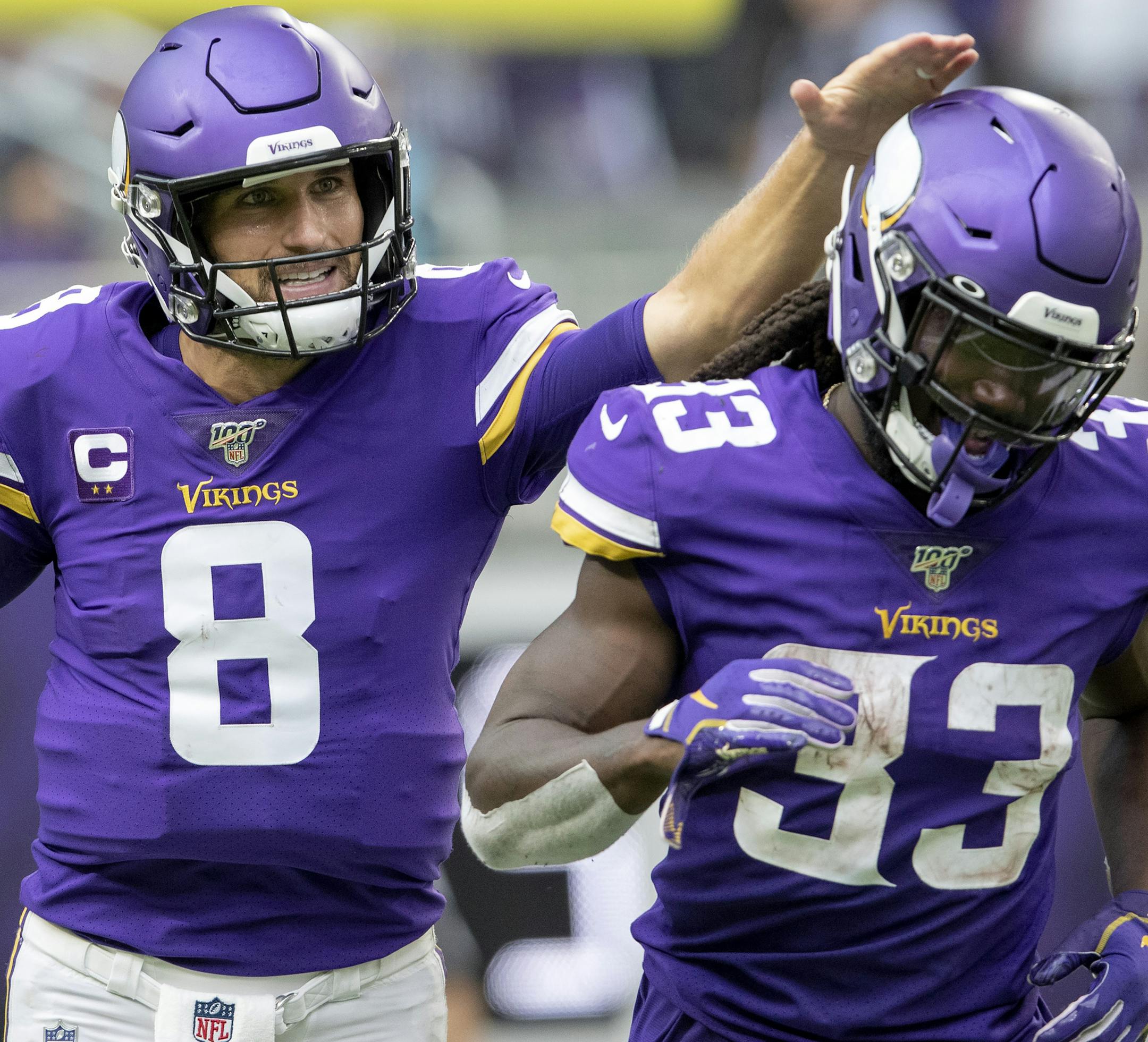 Minnesota Vikings quarterback Kirk Cousins (8) celebrated with Dalvin Cook (33) after scoring on a quarterback sneak in the second quarter. ] CARLOS GONZALEZ • cgonzalez@startribune.com – Minneapolis, MN – September 8, 2019, U.S. Bank Stadium, NFL, Minnesota Vikings vs. Atlanta Falcons
