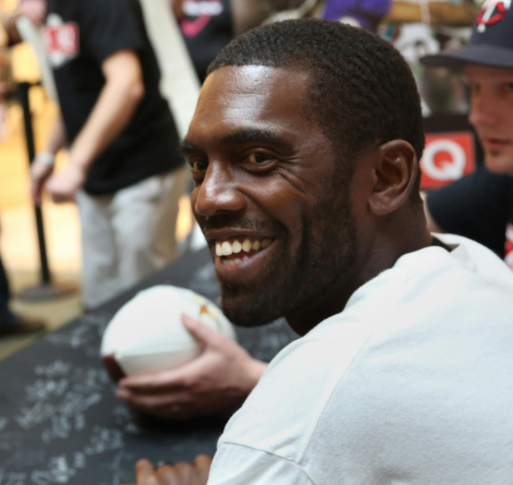Former Viking Randy Moss smiled at fans as he passed from signing autographs. ] (KYNDELL HARKNESS/STAR TRIBUNE) kyndell.harkness@startribune.com Former Minnesota Viking Randy Moss and Tyrone Cater signed autographs at the Ridgedale Mall in Minnetonka Min., Saturday, May 23, 2015. Ticket purchases benefit Tyrone Carter&#xed;s TC Elite Training School and will allow financially challenged Minnesota athletes the opportunity to attend Carter&#xed;s intensive football camps.