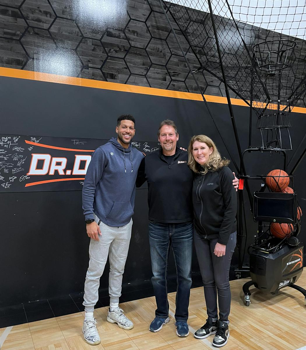 Jefferson Mason, left, Doug Campbell, middle, and college basketball analyst Debi Antonelli gathered for a photo at the Dr. Dish headquarters in Bloomington.
