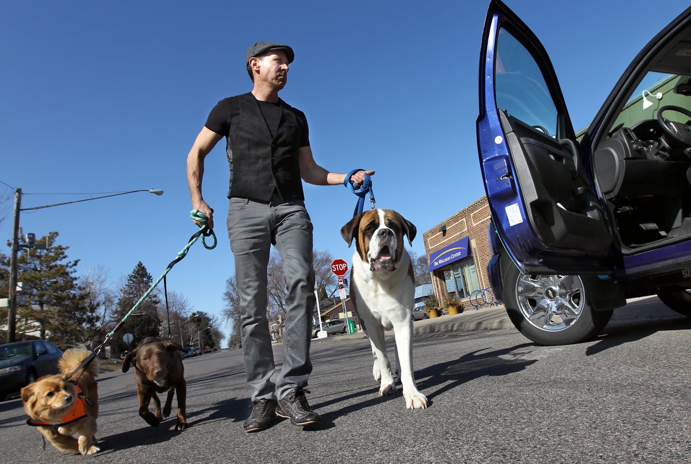 Daniel Peleske picks up Sadie, brown, Winston, big guy and and Brew, from the Canine Coach Last week as part of his service for dogs. A high-end dog taxi that he bills as a dog limo. STAR TRIBUNE/TOM WALLACE Assignments #20028357A April 2, 2013 EXTRA INFORMATION SLUG & MAGIC SAXO#: 987261 Pettaxi041313 EXTRA INFORMATION: The next time you hail a cab, it might be for your dog. Dog taxis -- vans that transport pets to groomers, vets and doggie daycare, have been common for years in places like Man