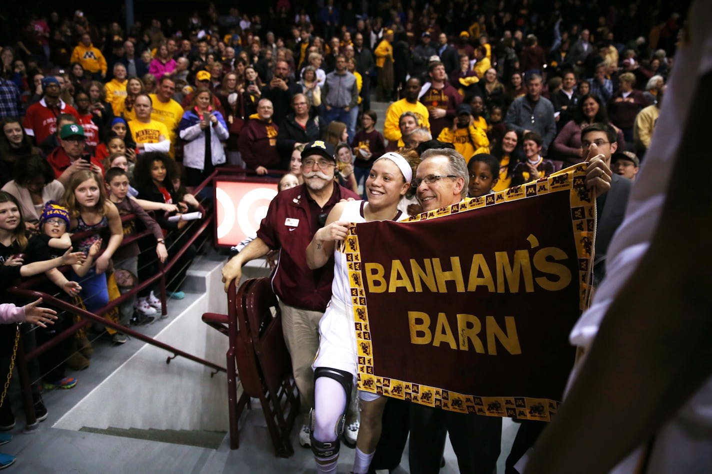 Gophers guard Rachel Banham posed for a photo with a fan after a 90-88 overtime victory over Ohio State in February.