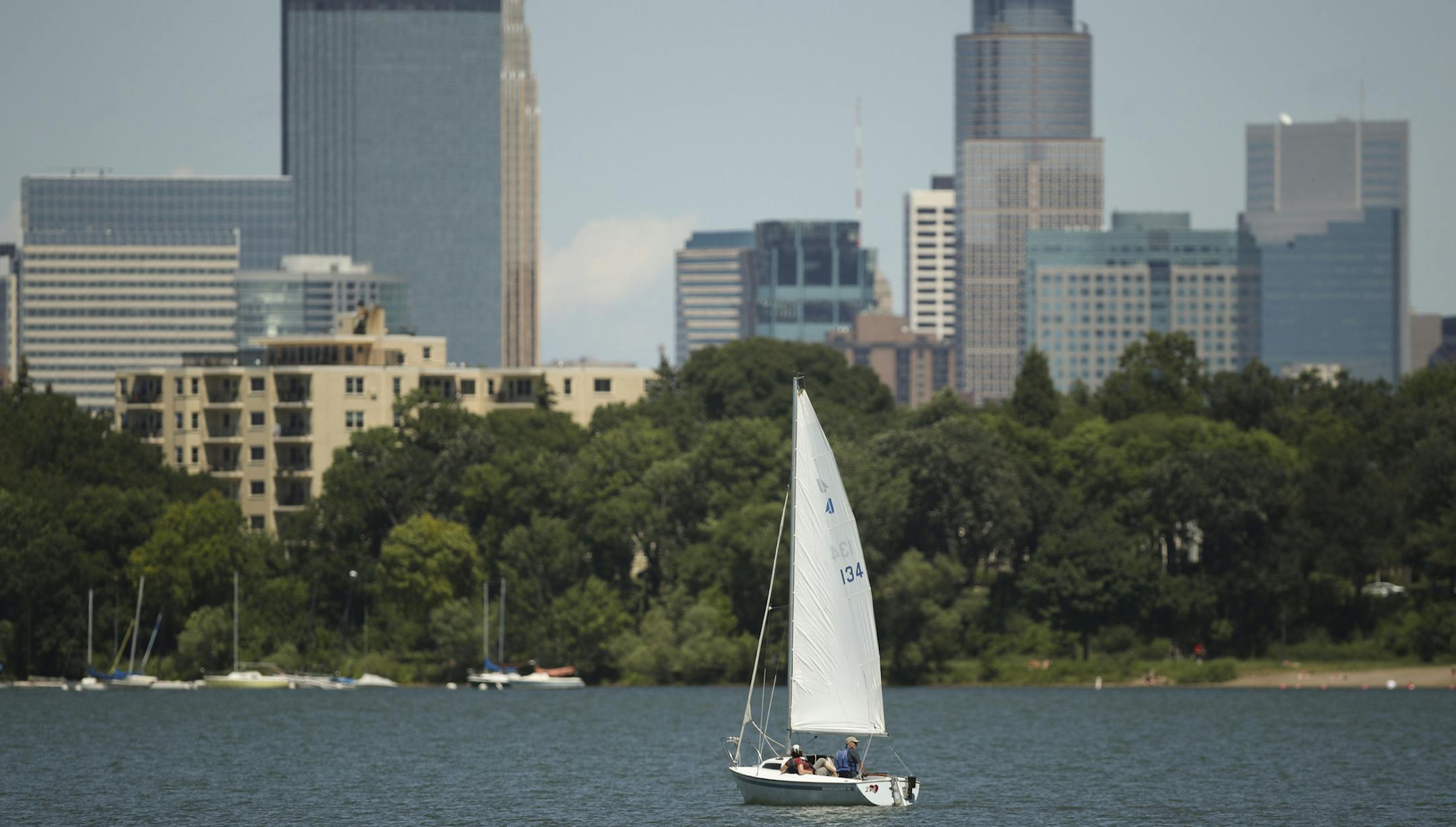 A sailboat made its way across Lake Bde Maka Ska Monday afternoon. ] JEFF WHEELER ï jeff.wheeler@startribune.com Following the lead of the Minneapolis Park and Recreation Board and the Minnesota Department of Natural Resources, the federal government now recognizes Lake Calhoun as Lake Bde Maka Ska. Swimmers jumped off the raft off Thomas Beach into Lake Bde Maka Ska Monday afternoon, July 16, 2018.