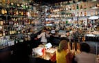 The bar at the St. Paul Grill features an extensive selection of liquor.