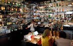 The bar at the St. Paul Grill features an extensive selection of liquor.