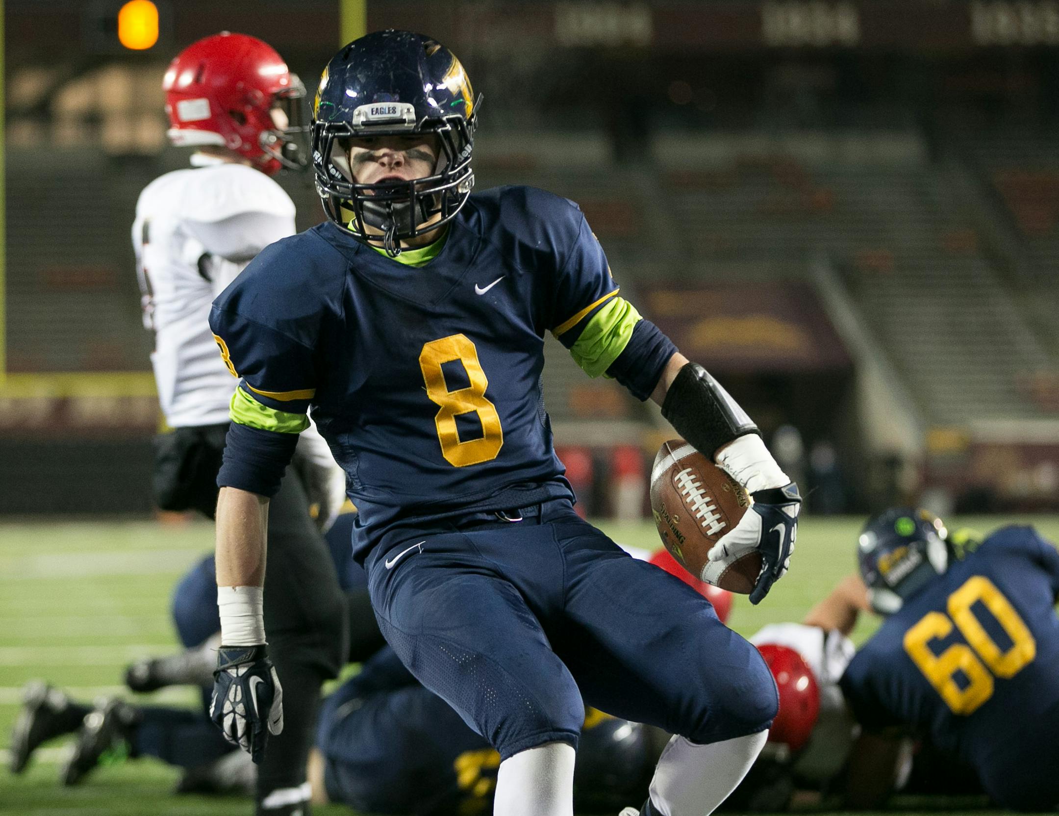 Totino-Grace wide receiver Ben Mezzenga (8) trots into the end zone for a second touchdown against Eden Prairie during the first quarter of Friday night's game. ] AARON LAVINSKY • aaron.lavinsky@startribune.com Totino-Grace takes on Eden Prairie in the Class 6A Prep Bowl Friday, Nov. 21, 2014 at TCF Bank Stadium.