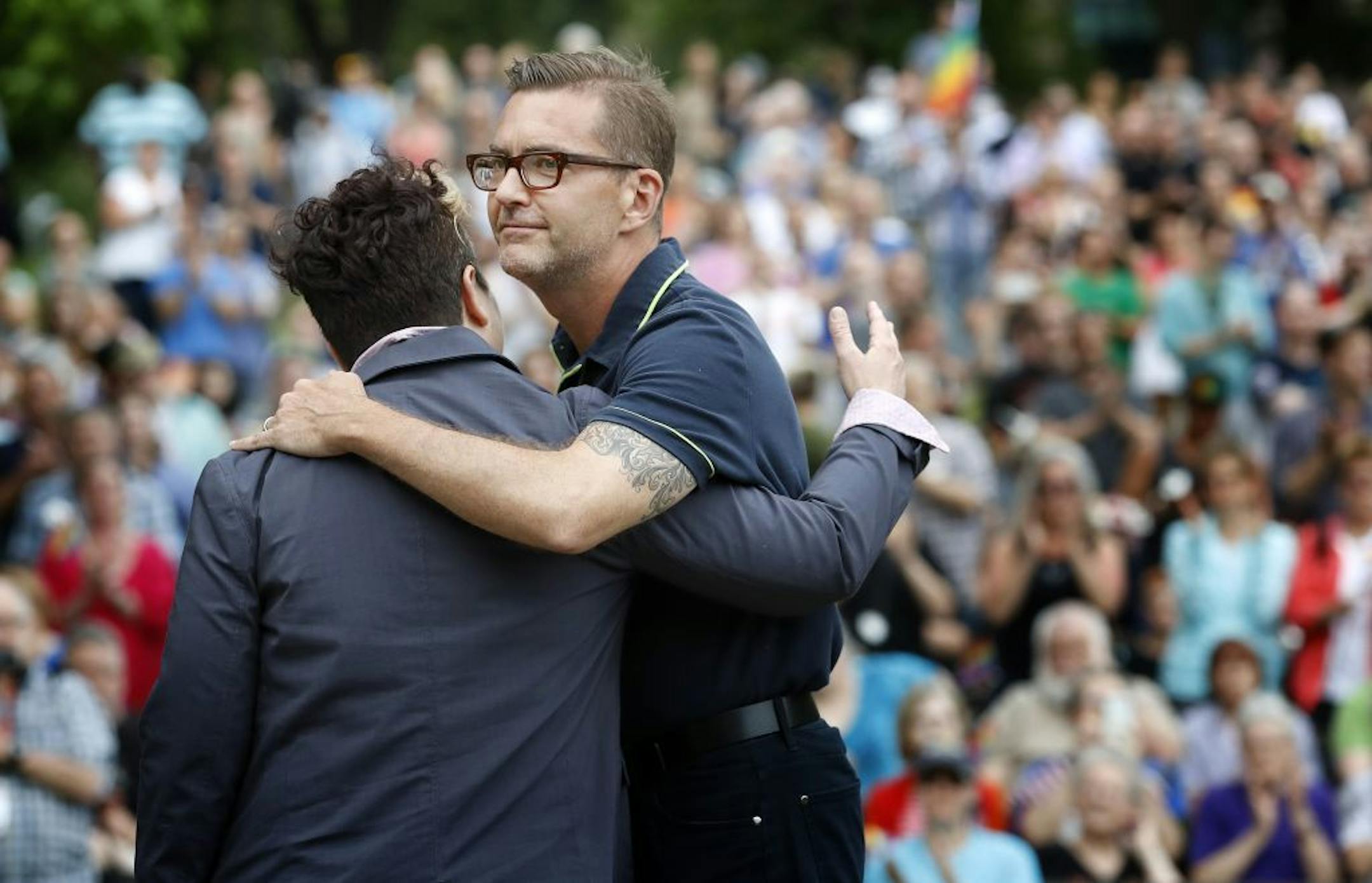 Sen. Scott Dibble, DFL-Minneapolis, got a hug from Monica Meyer, executive director of OutFront Minnesota, at a vigil held at Loring Park in Minneapolis for the victims of the Orlando shooting.