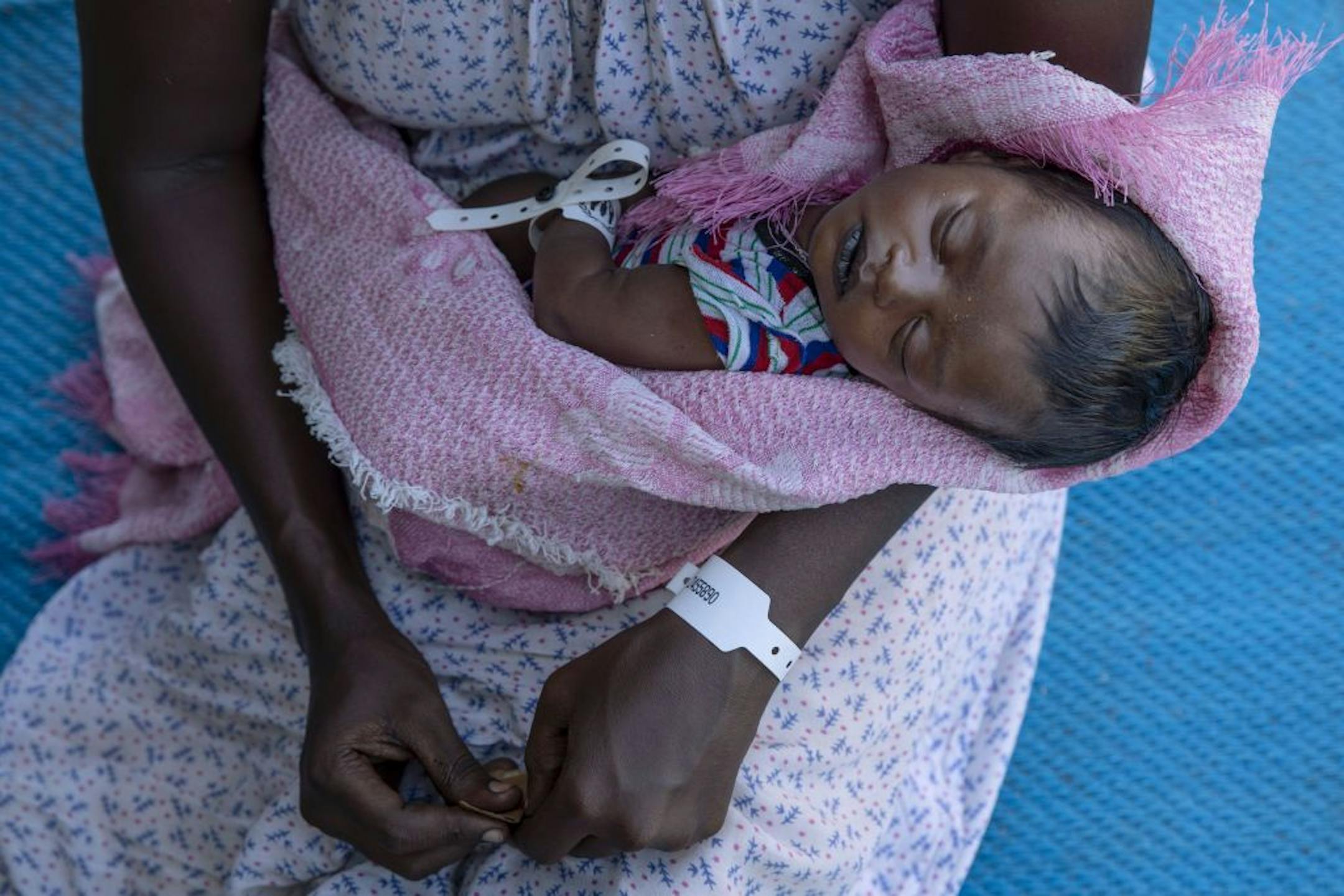 Terhas Tsfa, 25, who gave birth on a street as she fled the conflict in Ethiopia's Tigray region, holds her baby at Um Rakuba refugee camp in Qadarif, eastern Sudan, Monday, Nov. 23, 2020. Ethiopia's government is again warning residents of the besieged capital of the embattled Tigray region as the clock ticks on a 72-hour ultimatum before a military assault, saying "anything can happen."